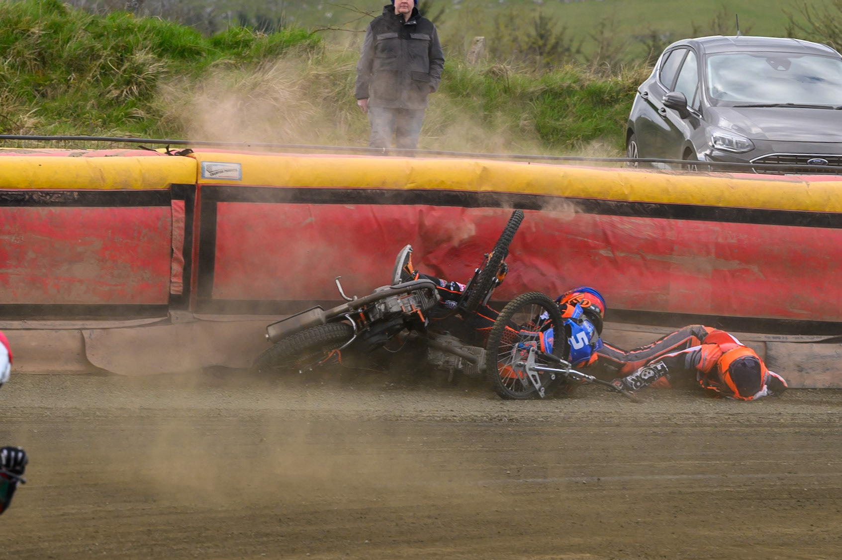 Connor Coles of NDL Nomads   in White fall and Jack Smith of Buxton Bulls   in Blue collides with him during the  Challenge match between Buxton Bulls and NDL Nomads at Hi-Edge Speedway, Buxton on Sunday 19th April 2026. (Photo: Ian Charles | MI News)