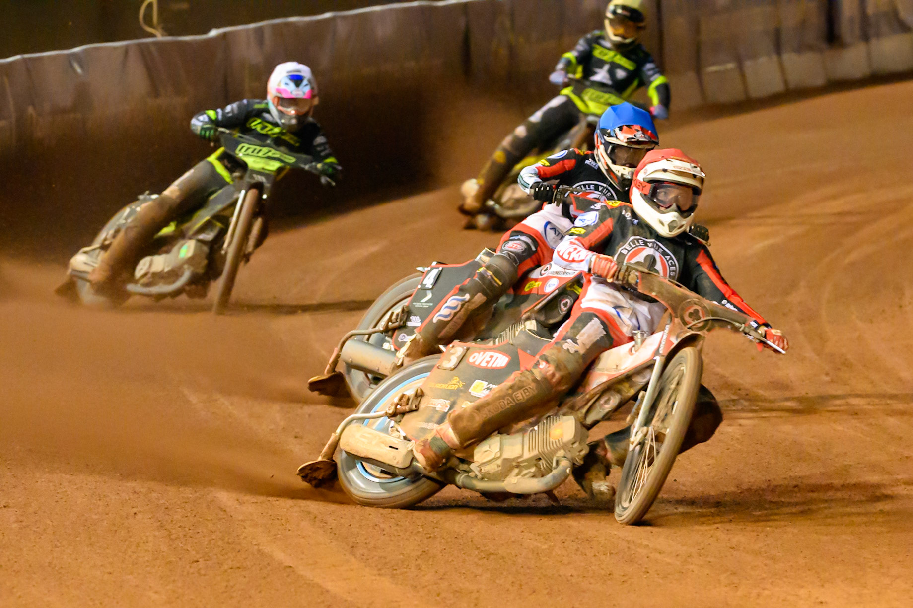 Peter Kildemand of Belle Vue Aces in Red  and Zach Cook of Belle Vue Aces in Blue  leading  Richard Lawson of Ipswich Witches in White  and Scott Nichols of Ipswich Witches in Yellow during the Rowe Motor Oil Premiership Play Off Semi Final 2nd leg match between Belle Vue Aces and Ipswich Witches at the National Speedway Stadium, Manchester on Monday 28th September 2026. (Photo: Ian Charles | MI News)