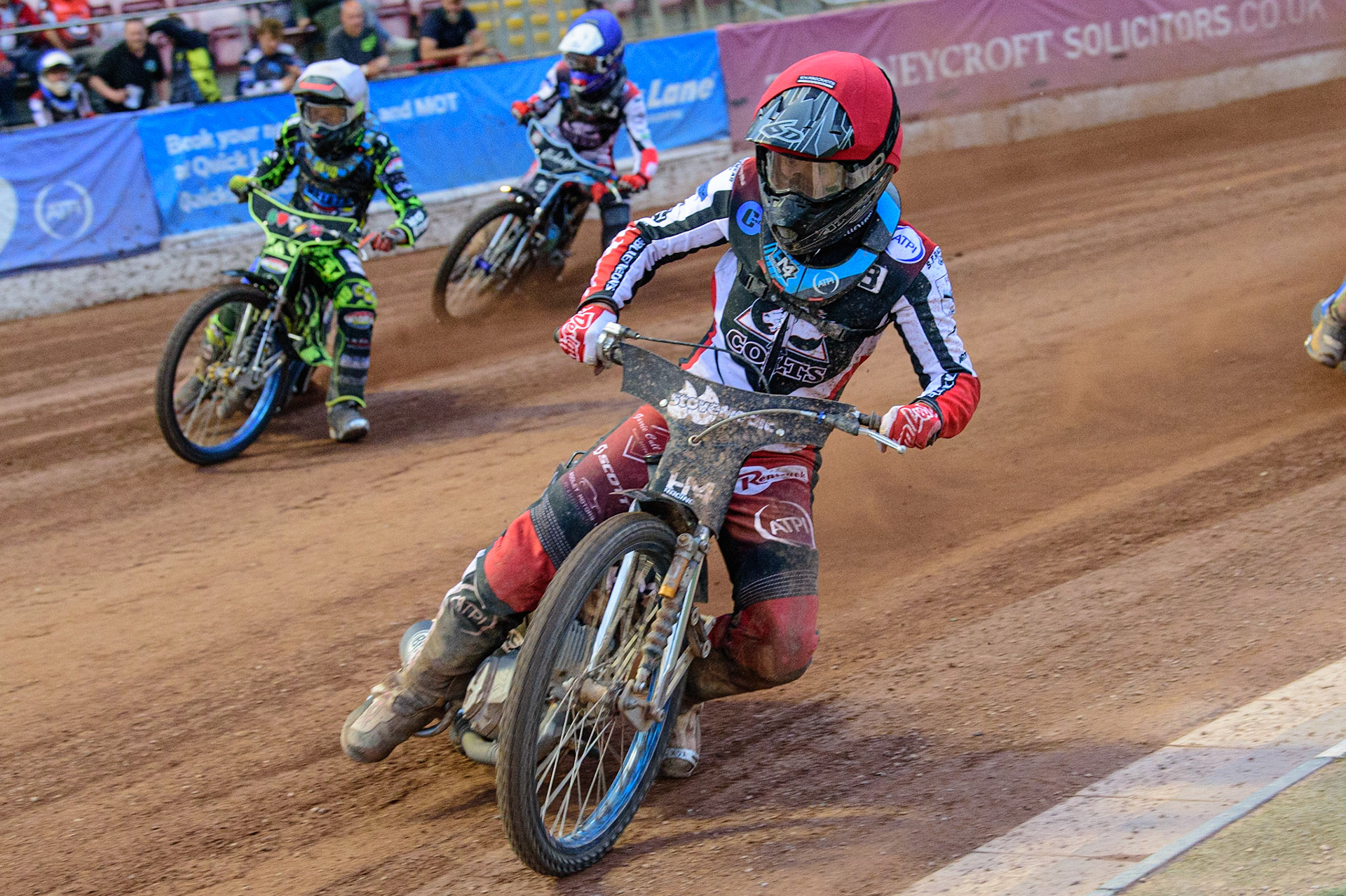 MANCHESTER, UK. JUN 24TH  Harry McGurk  (Red) leads Ace Pijper  (White) and Freddy Hodder  (Blue) during the National Development League match between Belle Vue Colts and Berwick Bullets at the National Speedway Stadium, Manchester on Friday 24th June 2022. (Credit: Ian Charles | MI News)