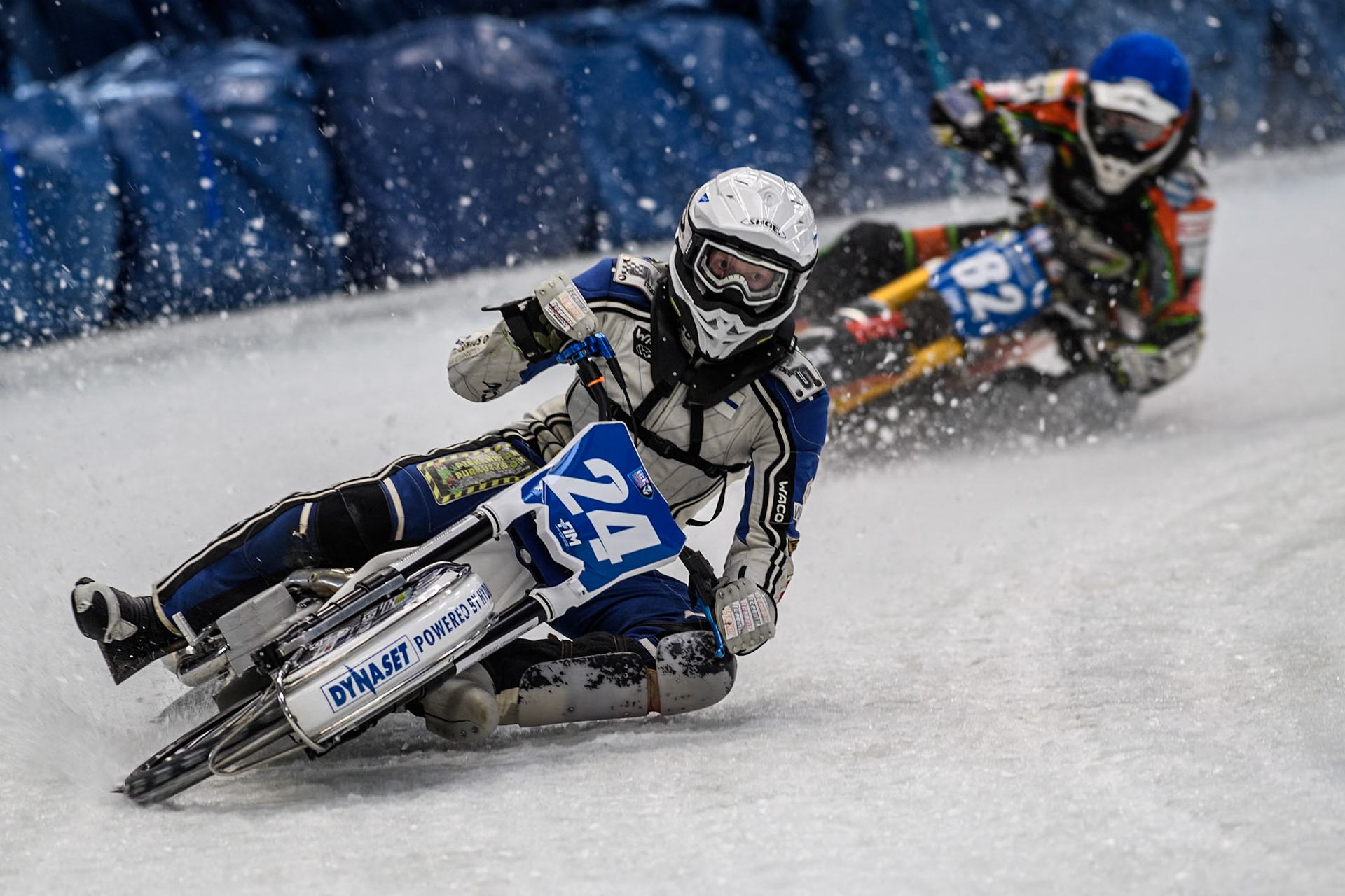 Finland's Max Koivula (24)  (White) leads  Germany's Markus Jell (82) (Blue) during the FIM Ice Speedway Gladiators World Championship Final 2 at the Max-Aicher-Arena, Inzell on Sunday 24 March 2024. (Photo: Ian Charles | MI News)