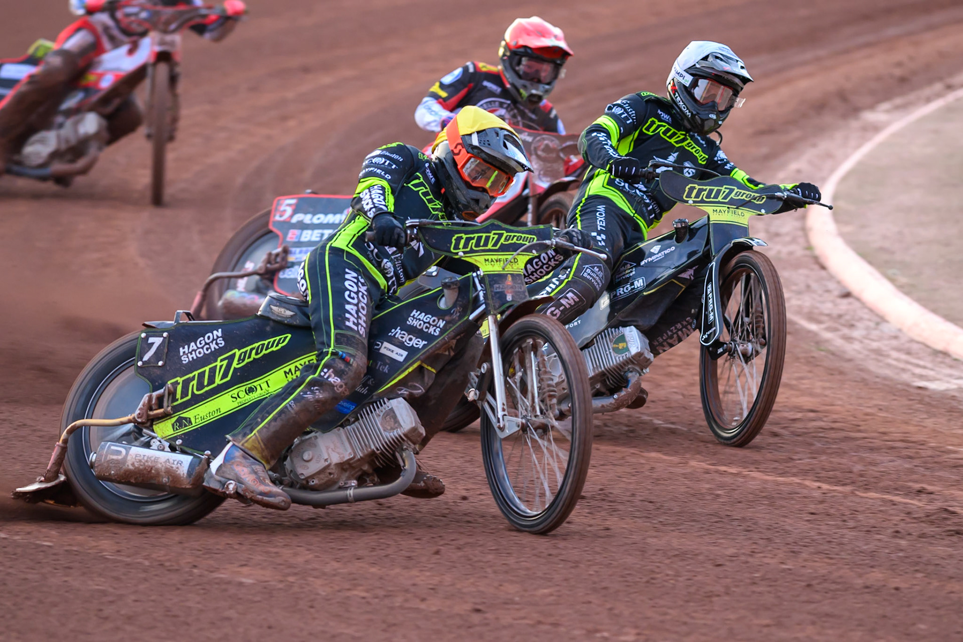 Jason Edwards of Ipswich Witches  in Yellow rides outside Dan Bewley of Belle Vue Aces  in Red and Tobiasz Musielak of Ipswich Witches  in White during the Rowe Motor Oil Premiership match between Belle Vue Aces and Ipswich Witches at the National Speedway Stadium, Manchester on Monday 20th April 2026. (Photo: Ian Charles | MI News)
