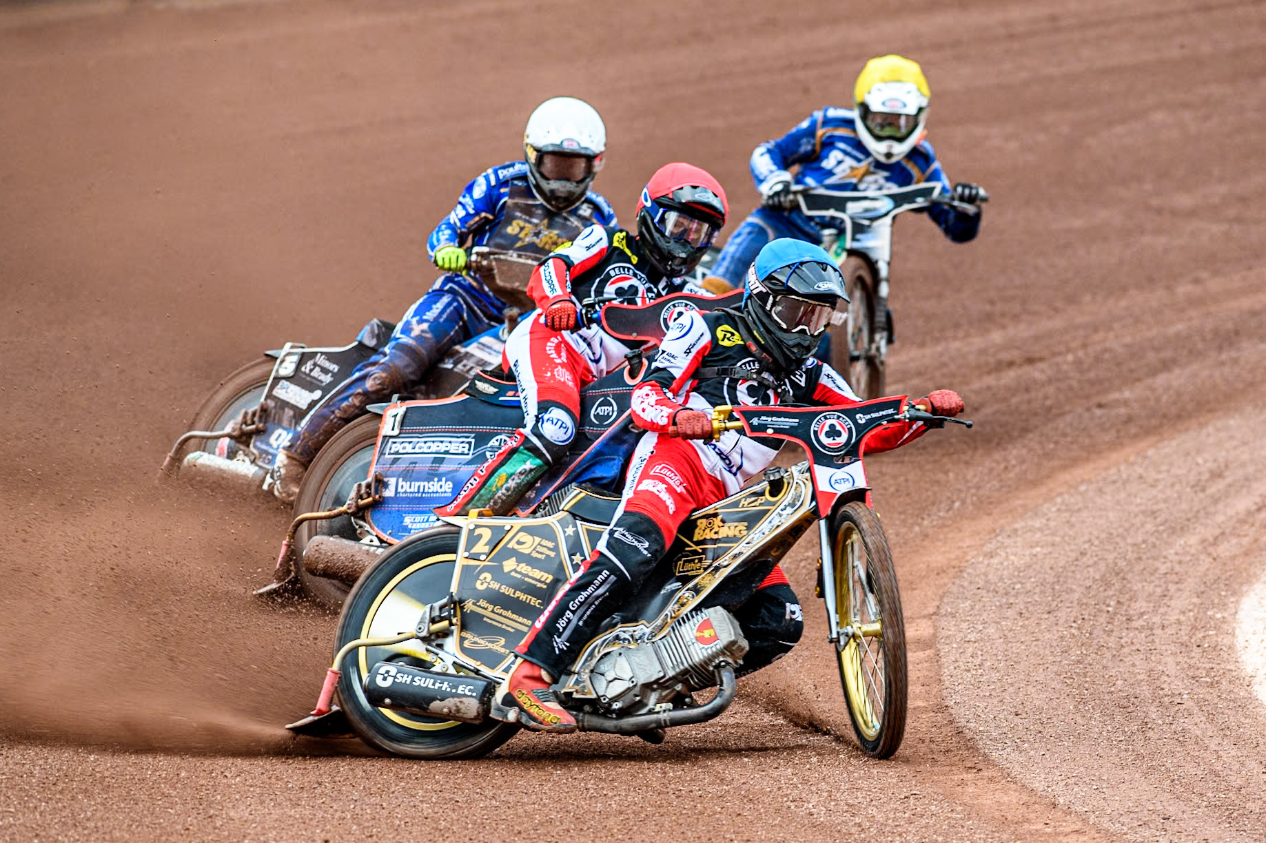 Belle Vue Aces' Norick Blodorn \v\ leading Belle Vue Aces' Brady Kurtz \r, King Lynn Stars' Nicolai Klindt in White and King Lynn Stars' Guest Richard Lawson in Yellow during the Rowe Motor Oil Premiership match between Belle Vue Aces and King's Lynn Stars at the National Speedway Stadium, Manchester on Monday 20th May 2024. (Photo: Ian Charles | MI News)