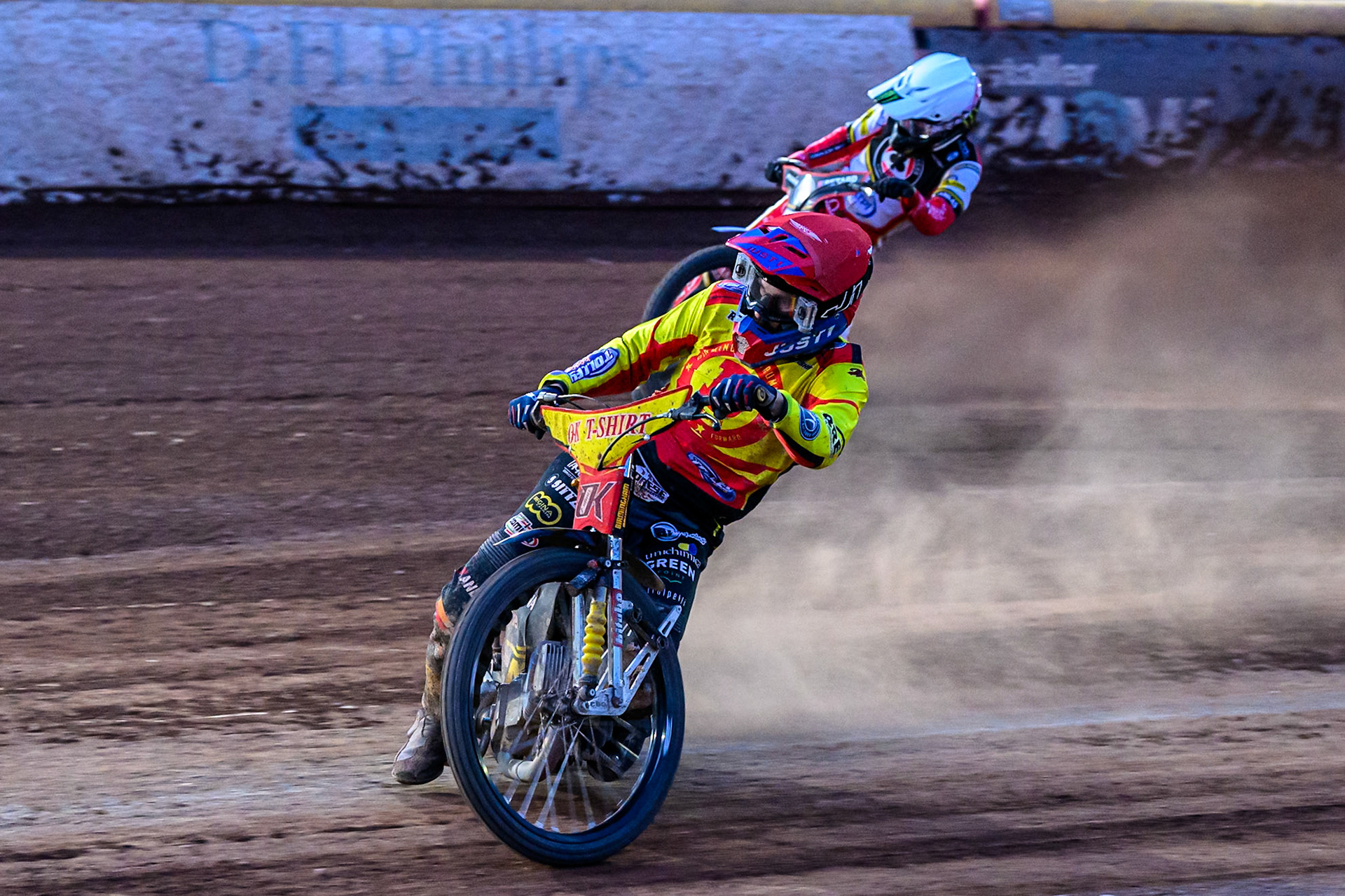 Birmingham Brummies' Paco Castagna in Red leading Belle Vue Aces' Dan Bewley in White during the Rowe Motor Oil Premiership match between Birmingham Brummies and Belle Vue Aces at Perry Bar Stadium, Birmingham on Monday 2nd June 2025. (Photo: Ian Charles | MI News)