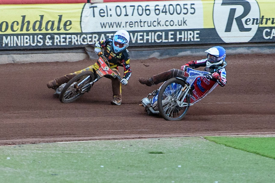 MANCHESTER, UK. JULY 29TH   Harry McGurk (Blue) picks up some drive and falls during the National Development League match between Belle Vue Colts and Leicester Lion Cubs at the National Speedway Stadium, Manchester on Thursday 29th July 2021. (Credit: Ian Charles | MI News)