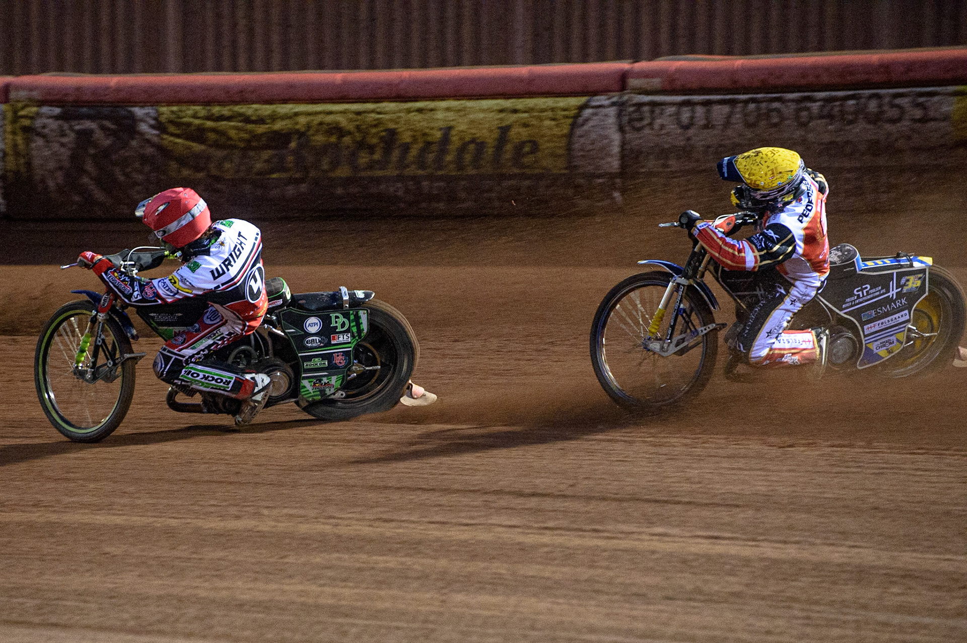 MANCHESTER, UK. AUG 9TH  Bjarne Pedersen  (Yellow) chases Charles Wright  (Red) during the SGB Premiership match between Belle Vue Aces and Peterborough at the National Speedway Stadium, Manchester on Monday 9th August 2021. (Credit: Ian Charles | MI News)
