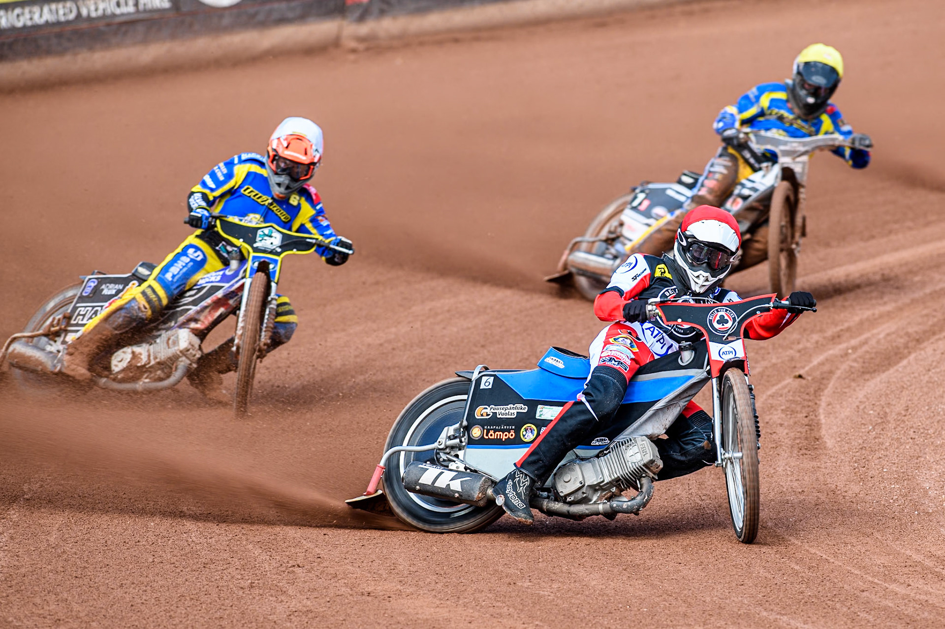 Belle Vue Aces' Antti Vuolas  in Red leading Sheffield Tigers' Jason Edwards  in White and Sheffield Tigers' Guest Rider Joe Thompson  in Yellow during the Rowe Motor Oil Premiership match between Belle Vue Aces and Sheffield Tigers at the National Speedway Stadium, Manchester on Monday 26th August 2024. (Photo: Ian Charles | MI News)