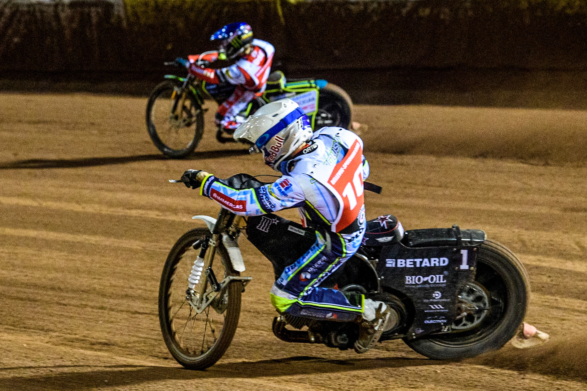 Poland’s Maceij Janowski (White) chases Australia's Jaimon Lidsey (Blue) during the Peter Craven Memorial Trophy meeting at the National Speedway Stadium, Manchester on Monday 18th March 2024. (Photo: Ian Charles | MI News)