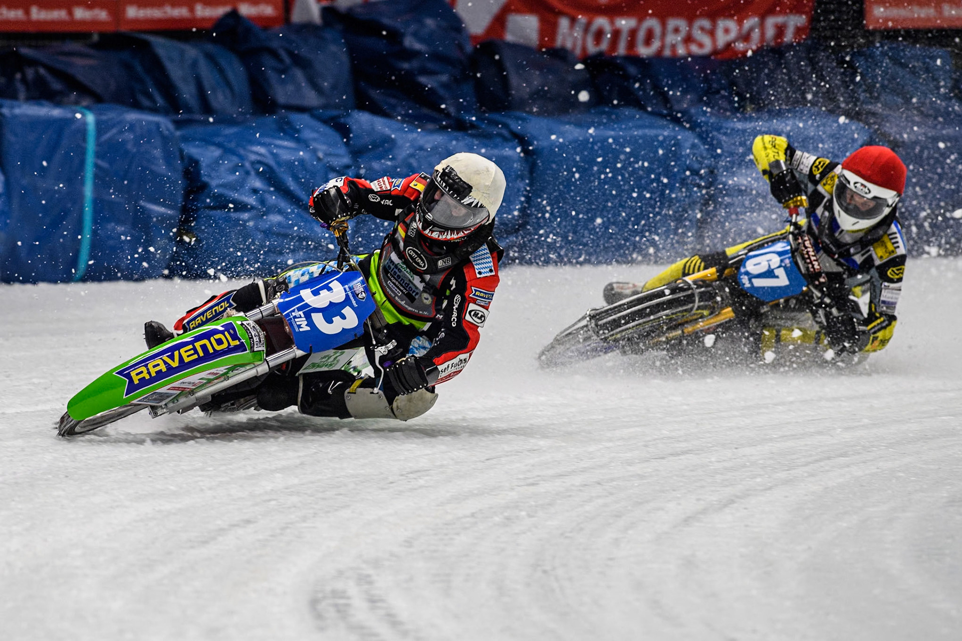 Germany's Johann Weber (33) (White) leads  Finland's Heikki Huusko (67) (Red) during the FIM Ice Speedway Gladiators World Championship Final 1 at the Max-Aicher-Arena, Inzell on Saturday 23 March 2024. (Photo: Ian Charles | MI News)