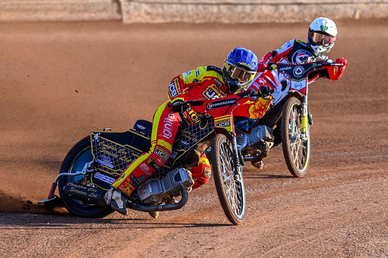 Leicester Lions' Kyle Howarth in Blue leading Belle Vue Aces' Jaimon Lidsey in White during the Rowe Motor Oil Premiership match between Leicester Lions and Belle Vue Aces at the Hydroscand Arena, Leicester on Thursday 19th June 2025. (Photo: Ian Charles | MI News)