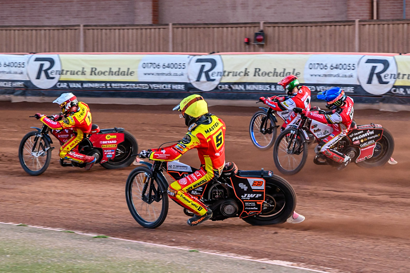 Leicester Lions' Sam Masters  in Yellow on the inside  of Belle Vue Aces' Dan Bewley in Blue, Belle Vue Aces' Brady Kurtz in Red with Leicester Lions' Max Fricke  in White leading during the Rowe Motor Oil Premiership match between Belle Vue Aces and Leicester Lions at the National Speedway Stadium, Manchester on Monday 14th July 2025. (Photo: Ian Charles | MI News)