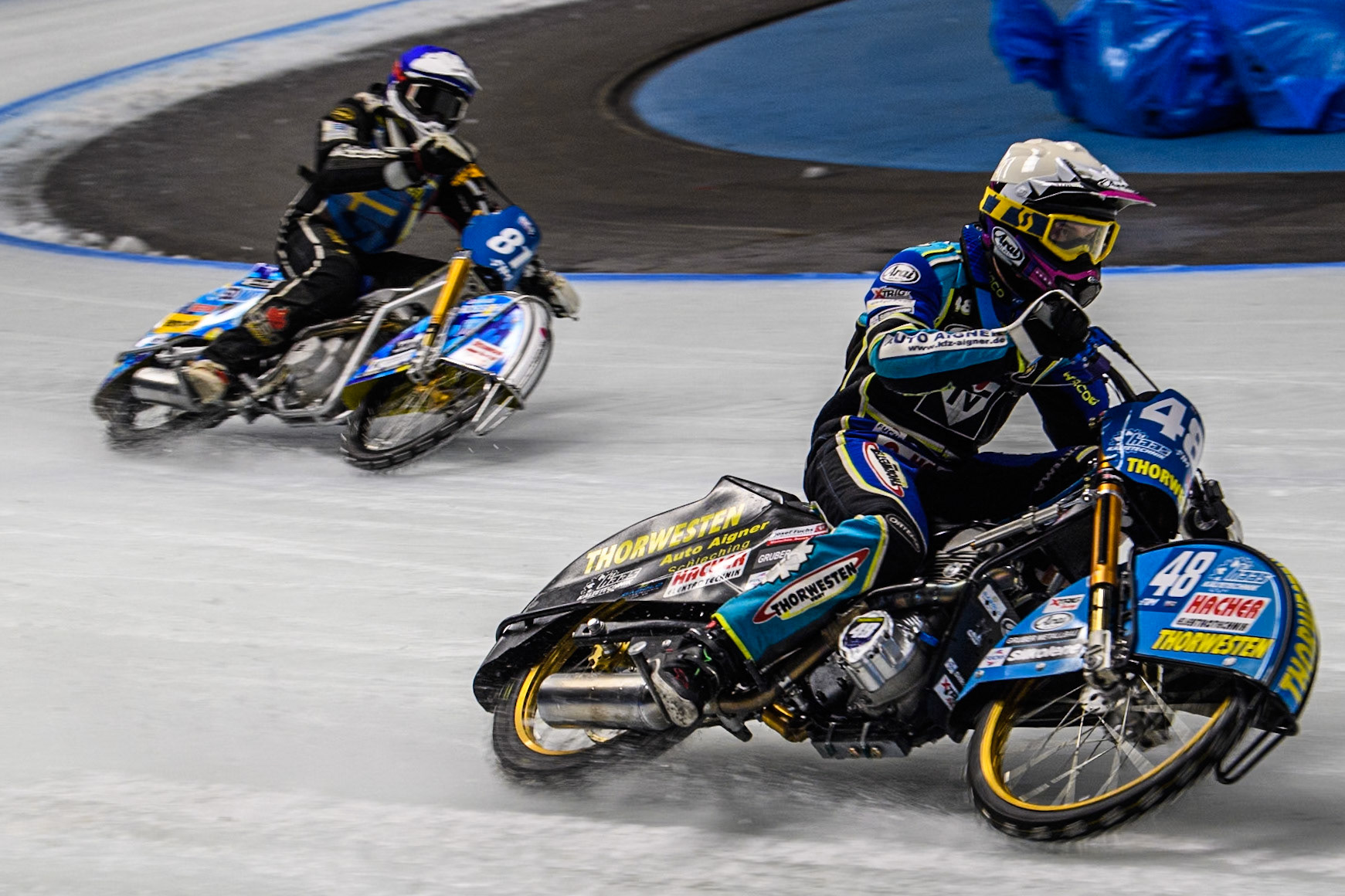 Luca Bauer (48) of Germany in Yellow leading Jimmy Olsén (81) of Sweden in Blue during the Ice Speedway Gladiators World Championship Final 1 at Max-Aicher-Arena, Inzell on Saturday 15th March 2025. (Photo: Ian Charles | MI News)