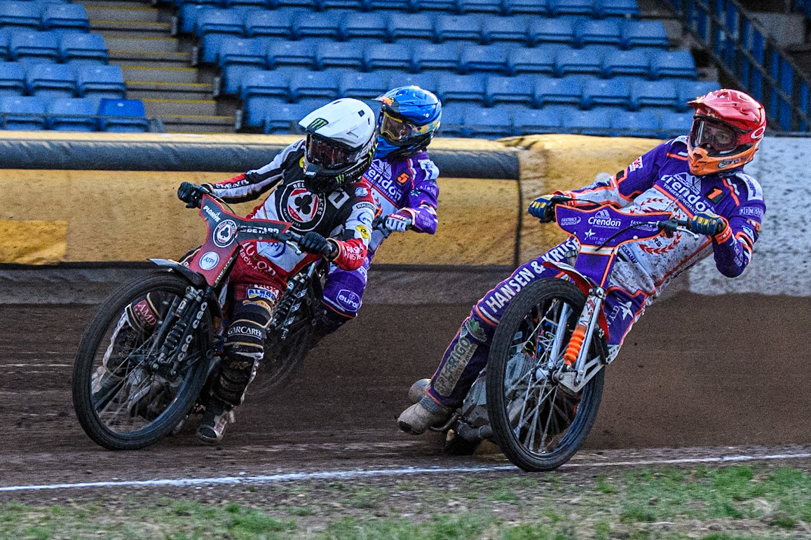 Dan Bewley (White) leads Ben Cook (Red) and Vadim Tarasenko (Blue) during the Sports Insure Premiership match between Peterborough and Belle Vue Aces at East of England Showground, Peterborough on Monday 26th June 2023. (Photo: Ian Charles | MI News)
