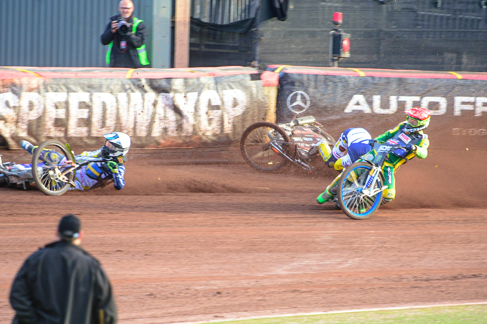MANCHESTER, UK. OCT 16TH Pontus Aspgren of Sweden (White) slides off as Jacob Thorsell of Sweden hits the airfence during the Monster Energy FIM Speedway of Nations at the National Speedway Stadium, Manchester on Saturday  16th October 2021. (Credit: Ian Charles | MI News)