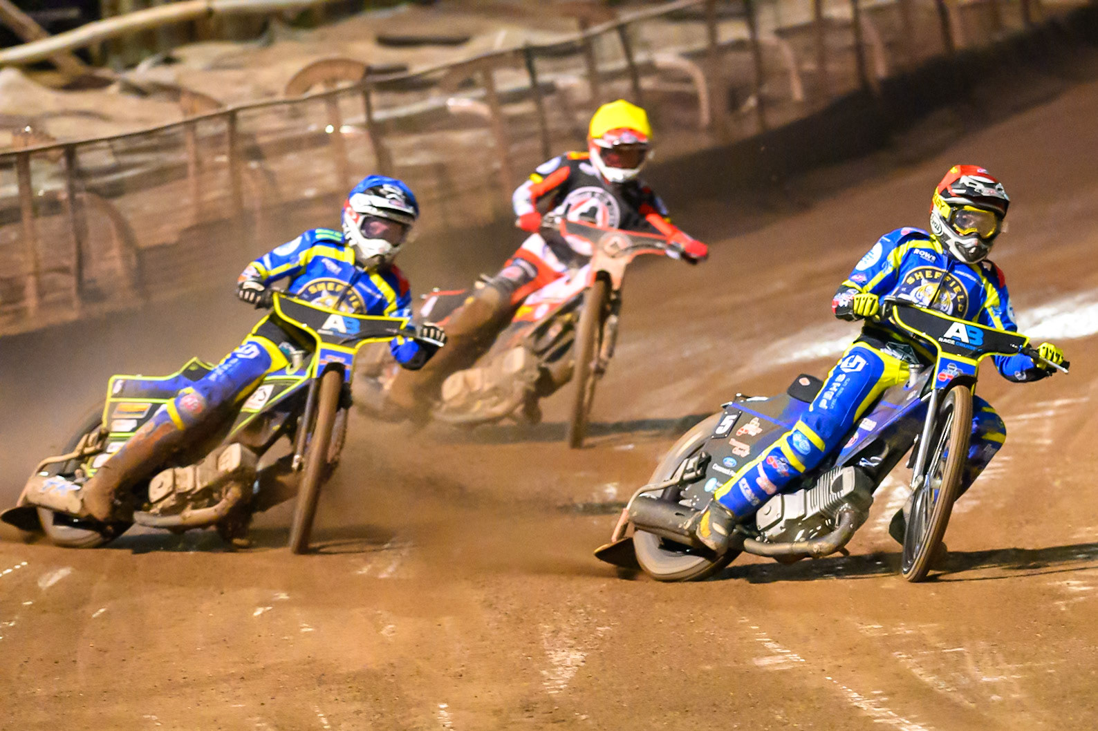 Josh Pickering of Sheffield Tigers  in Red leading Jye Etheridge of Sheffield Tigers  in Blue and Zach Cook of Belle Vue Aces in Yellow during the Knockout Cup Northern Section match between Sheffield Tigers and Belle Vue Aces at Owlerton Stadium, Sheffield on Thursday 2nd April 2026. (Photo: Ian Charles | MI News)