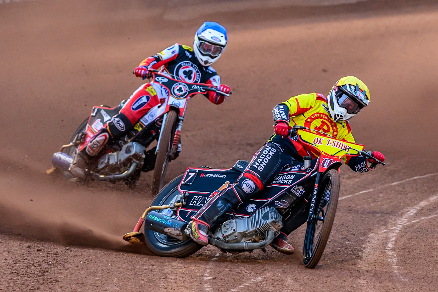 Sam Hagon of Birmingham Brummies in Yellow leading Jake Mulford of Belle Vue Aces  in Blue during the Rowe Motor Oil Premiership match between Belle Vue Aces and Birmingham Brummies at the National Speedway Stadium, Manchester on Monday 18th August 2025. (Photo: Ian Charles | MI News)