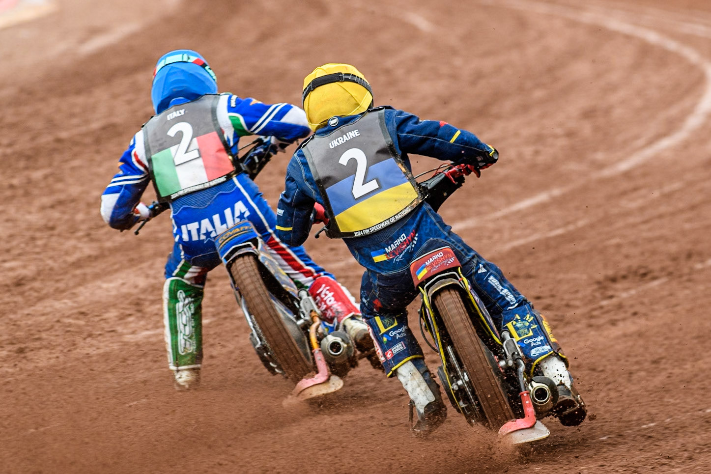 Marko Levishyn of Ukraine in Yellow chases Nicolas Covatti of Italy in Blue during the Monster Energy FIM Speedway of Nations Semi-Final 1 at the National Speedway Stadium, Manchester on Tuesday 9th July 2024. (Photo: Ian Charles | MI News)
