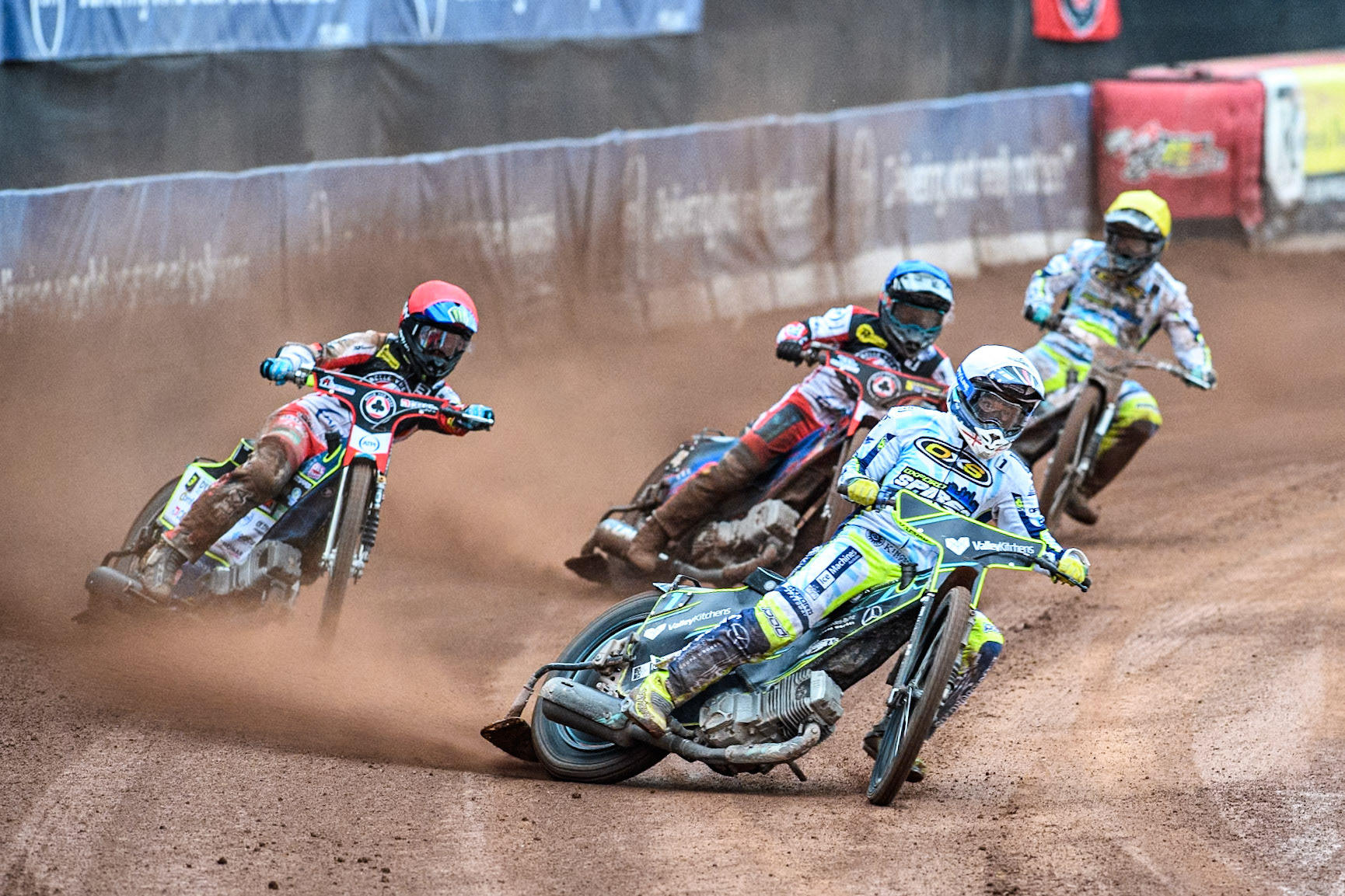 Oxford Spires' Maciej Janowski in White leading Belle Vue Aces' Jaimon Lidsey  in Red, Belle Vue Aces' Ben Cook in Blue and Oxford Spires' Erik Riss in Yellow during the Rowe Motor Oil Premiership match between Belle Vue Aces and Oxford Spires at the National Speedway Stadium, Manchester on Monday 22nd July 2024. (Photo: Ian Charles | MI News)