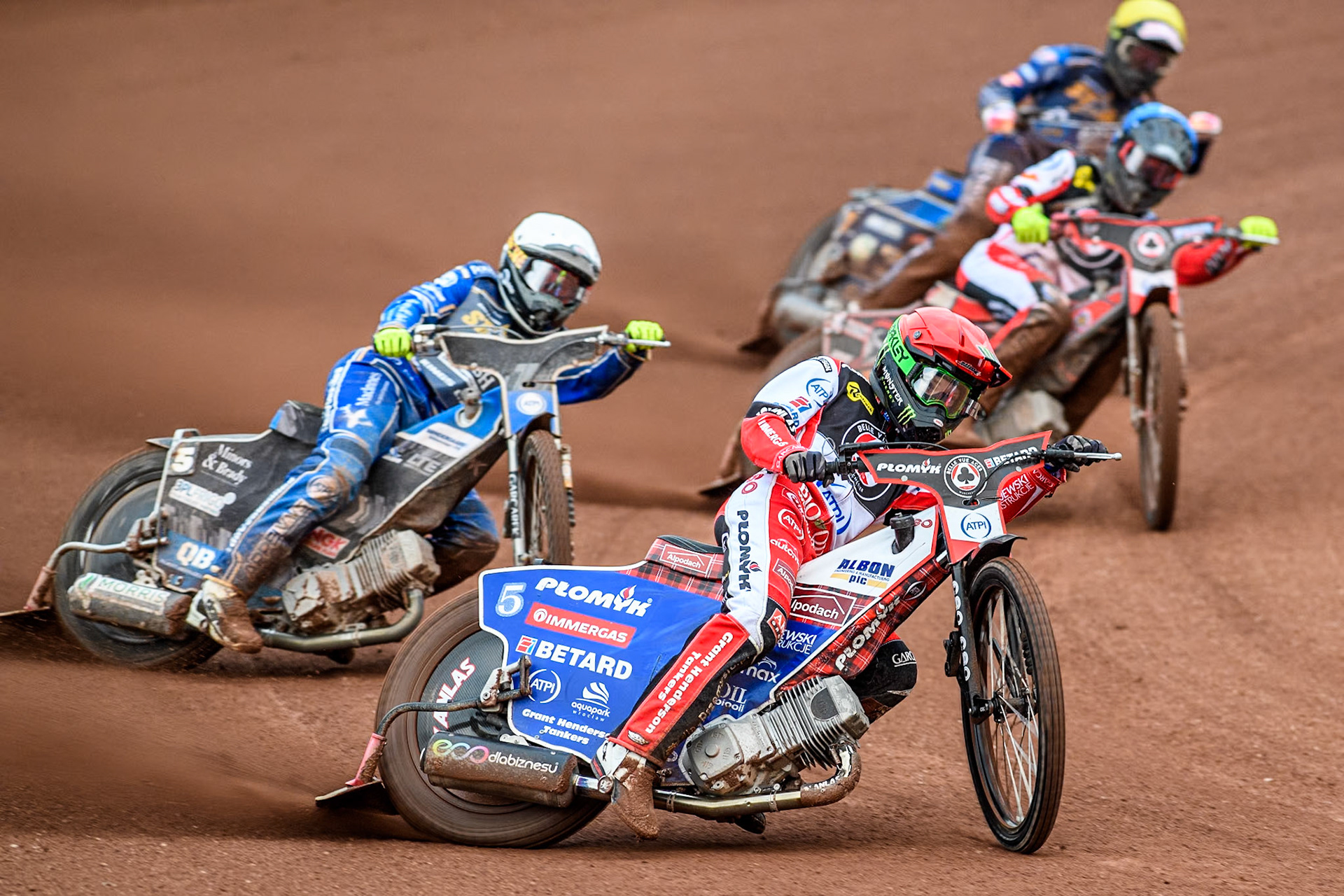 Belle Vue Aces' Dan Bewley in Red leading King Lynn Stars' Nicolai Klindt in White, Belle Vue Aces' Connor Bailey in Blue and King Lynn Stars' Anders Rowe in Yellow during the Rowe Motor Oil Premiership match between Belle Vue Aces and King's Lynn Stars at the National Speedway Stadium, Manchester on Monday 20th May 2024. (Photo: Ian Charles | MI News)