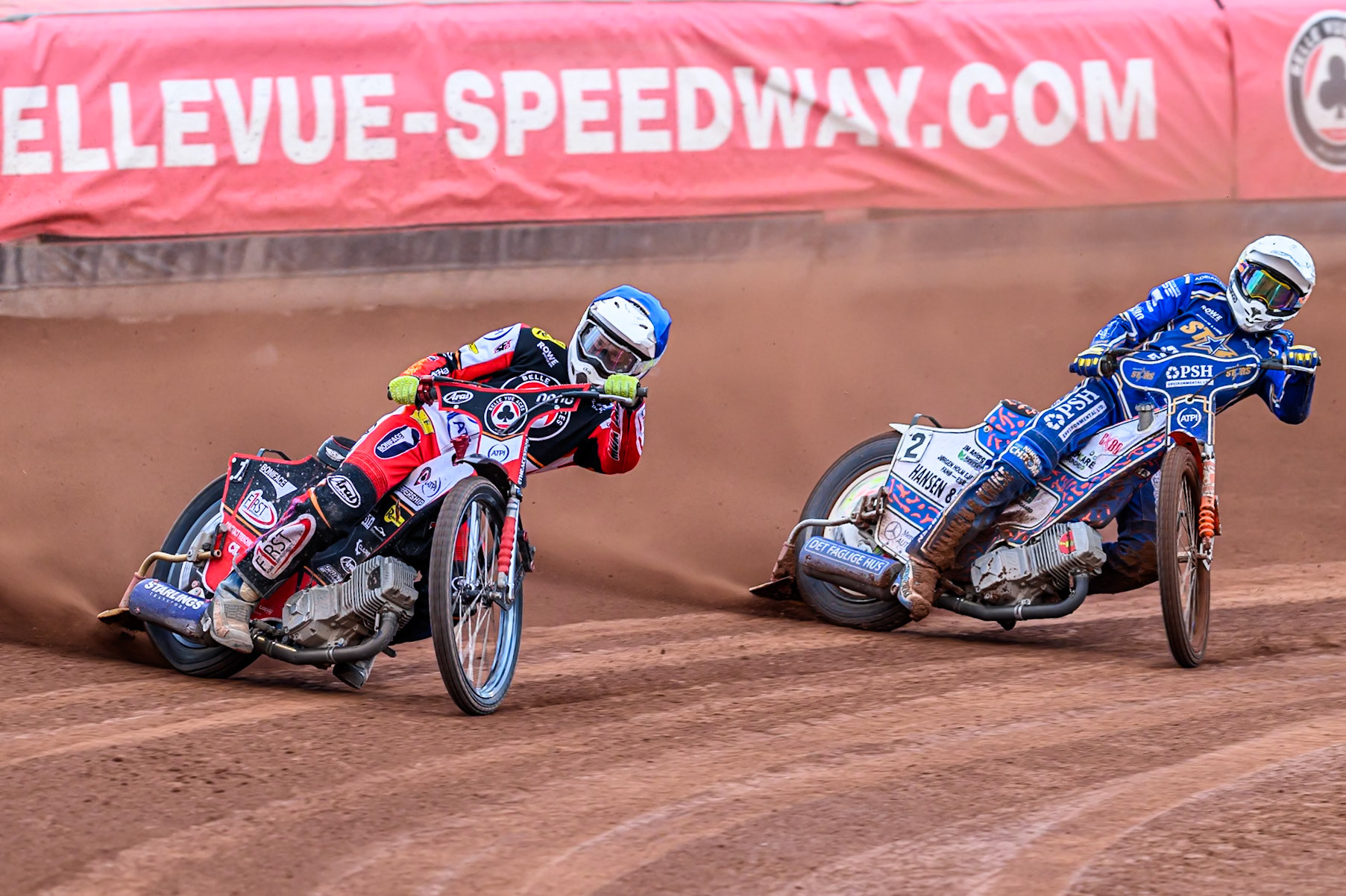 Belle Vue Aces' Jake Mulford in Blue leading Kings Lynn Stars' Niels-Kristian Iversen in White during the Rowe Motor Oil Premiership match between Belle Vue Aces and King's Lynn Stars at the National Speedway Stadium, Manchester on Monday 23rd June 2025. (Photo: Ian Charles | MI News)