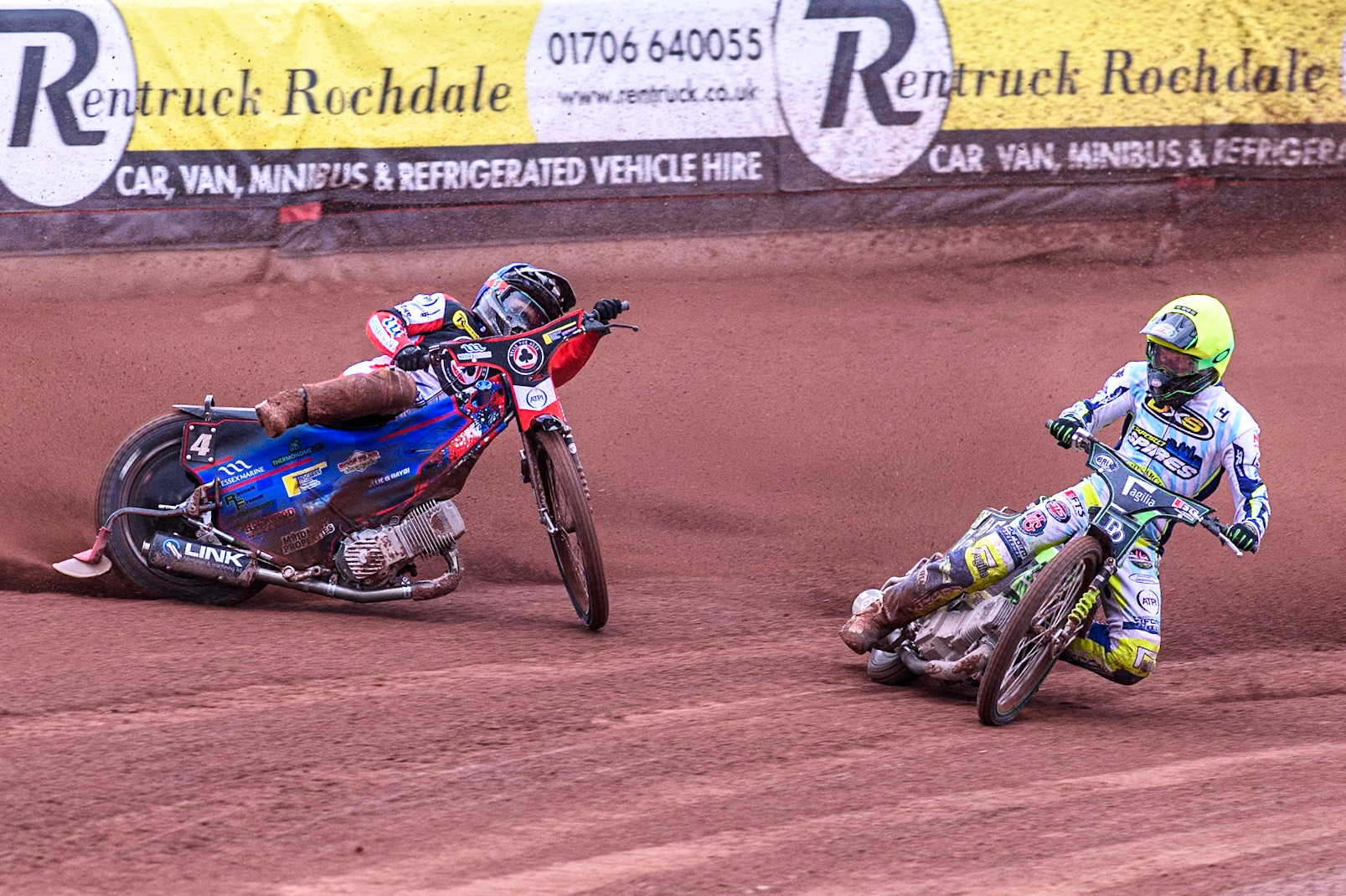 Belle Vue Aces' Ben Cook in Blue loses control after a tangle with Oxford Spires' Charles Wright in Yellow during the Rowe Motor Oil Premiership match between Belle Vue Aces and Oxford Spires at the National Speedway Stadium, Manchester on Monday 22nd July 2024. (Photo: Ian Charles | MI News)