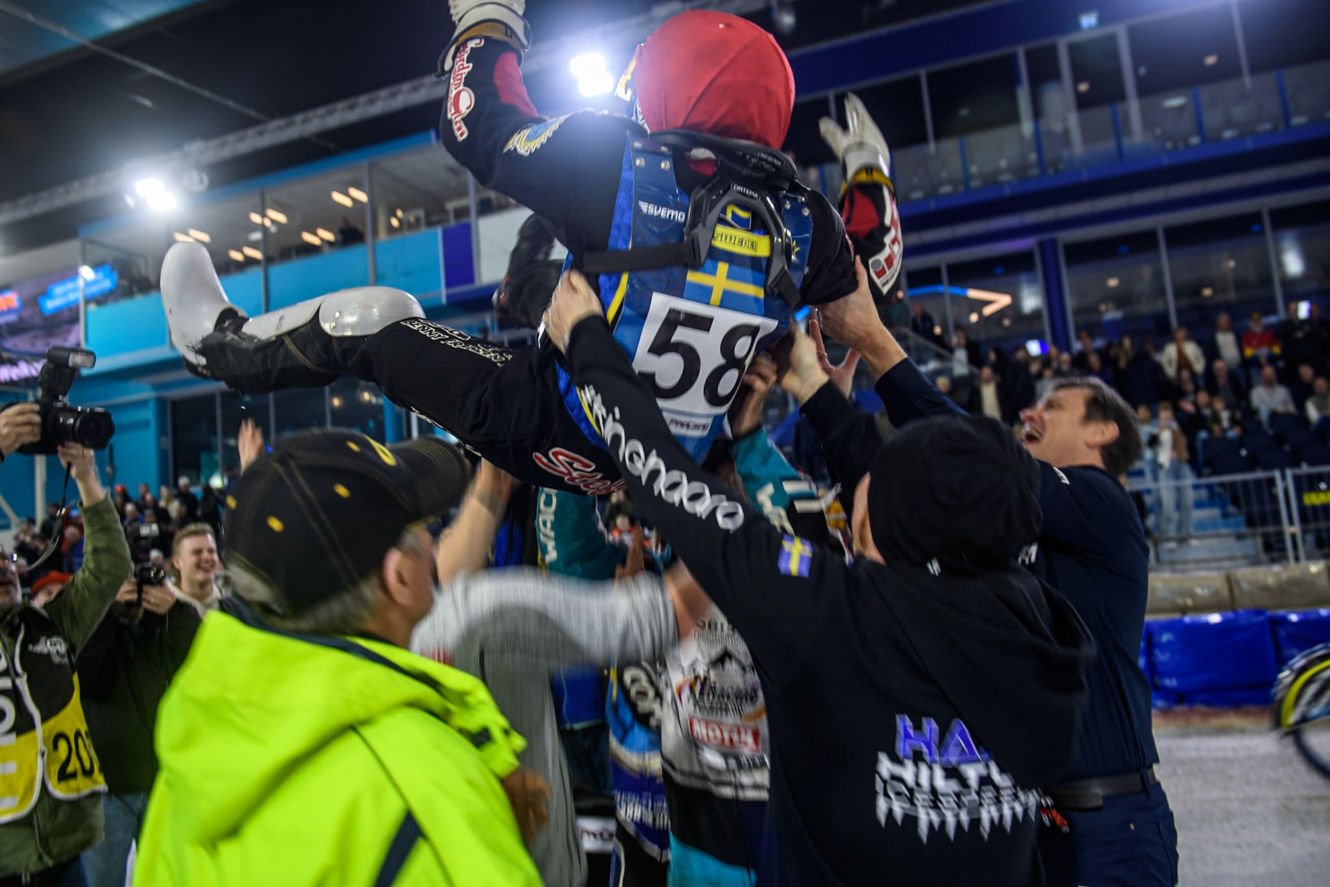 Sweden's Stefan Svensson (58) gets the bumps after winning his first ever Grand Final during the FIM Ice Speedway Gladiators World Championship Final 4 at Ice Rink Thialf, Heerenveen on Sunday 7th April 2024. (Photo: Ian Charles | MI News)