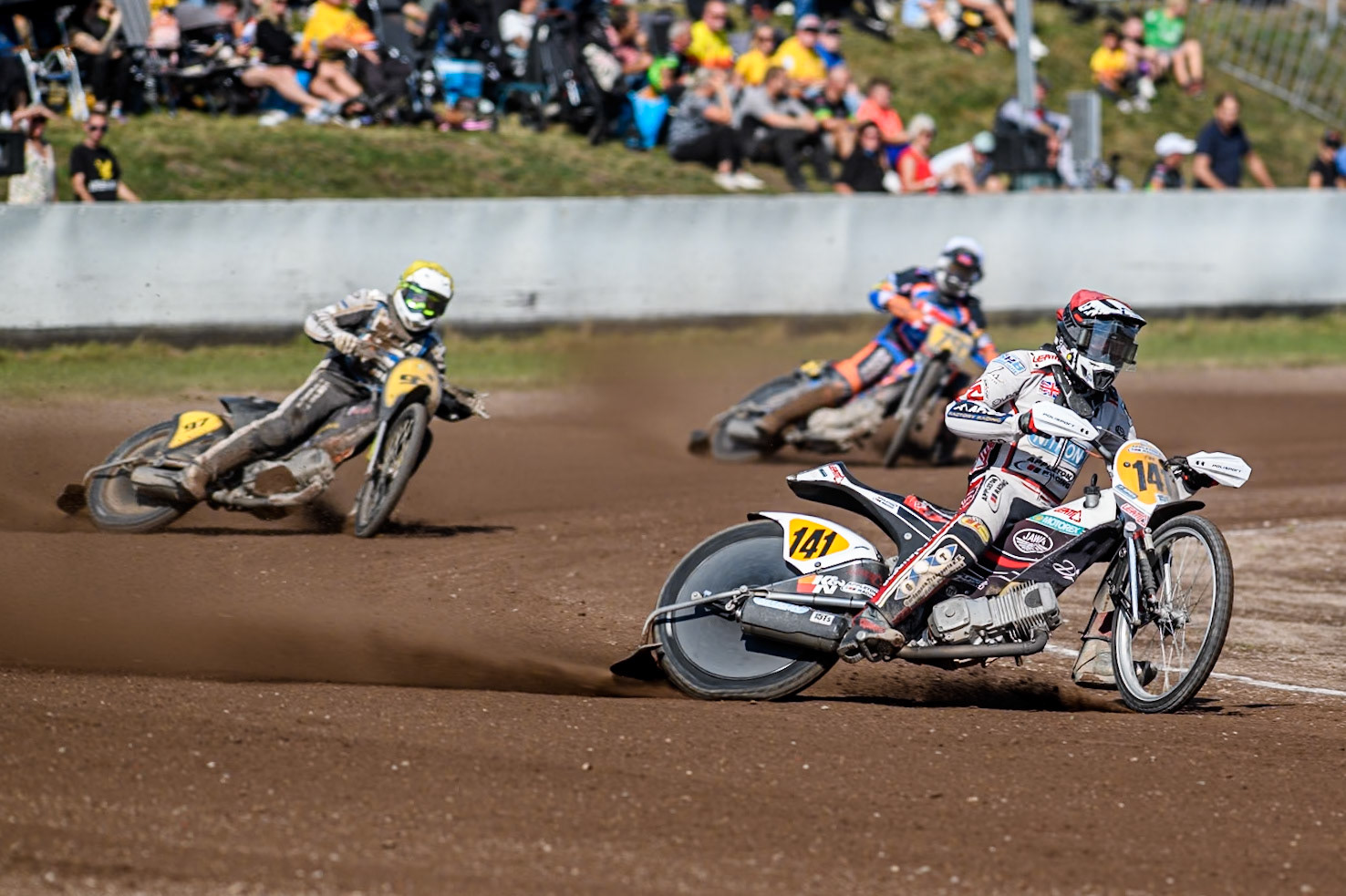 Andrew Appleton (141) of Great Britain  in Red leading Henri Ahlbom (97) of Finland in Yellow and Jacob Bukhave (79) of Denmark in White during the FIM Long Track World Championship Final 5 at the Speed Centre Roden, Roden, Netherlands on Sunday 22nd September 2024. (Photo: Ian Charles | MI News)