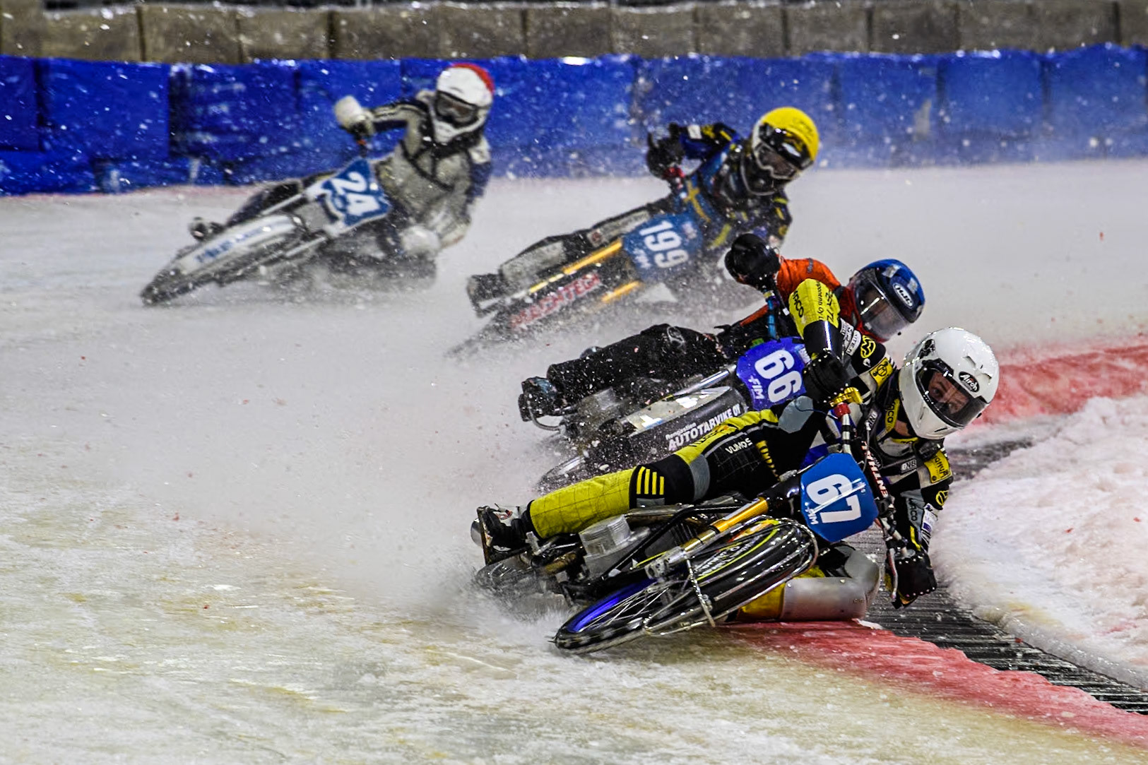Finland's Heikki Huusko (67) in White leading Finland's Aki Ala-Riihimäki (66) in Blue Finland's Max Koivula (24) in Red and Sweden's Martin Haarahiltunen (199)  in Yellow during the FIM Ice Speedway Gladiators World Championship Final 3 at Ice Rink Thialf, Heerenveen on Saturday 6th April 2024. (Photo: Ian Charles | MI News)