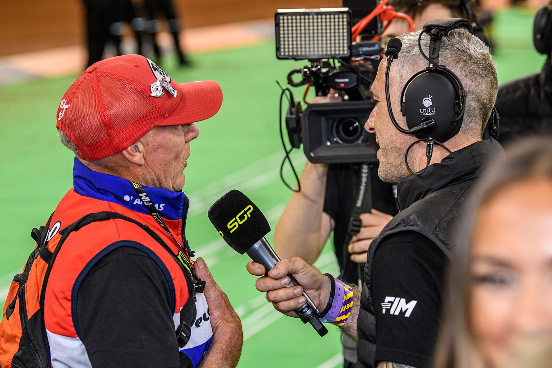 Dan Bewley’s father Neil (Left) is interviewed for the TV by Scott Nicholls during the FIM Speedway Grand Prix of Great Britain at The Principality Stadium, Cardiff on Saturday 17th August 2024. (Photo: Ian Charles | MI News)