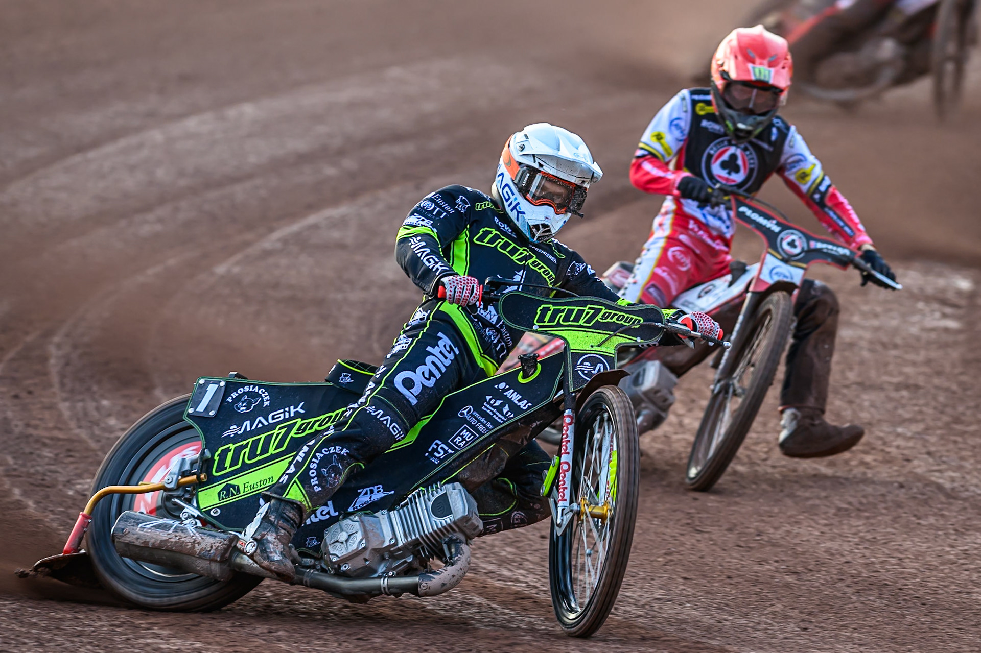 Ipswich Witches' Emil Saifutdinov  in White leading Belle Vue Aces' Dan Bewley  in Red during the Rowe Motor Oil Premiership match between Belle Vue Aces and Ipswich Witches at the National Speedway Stadium, Manchester on Monday 30th June 2025. (Photo: Ian Charles | MI News)