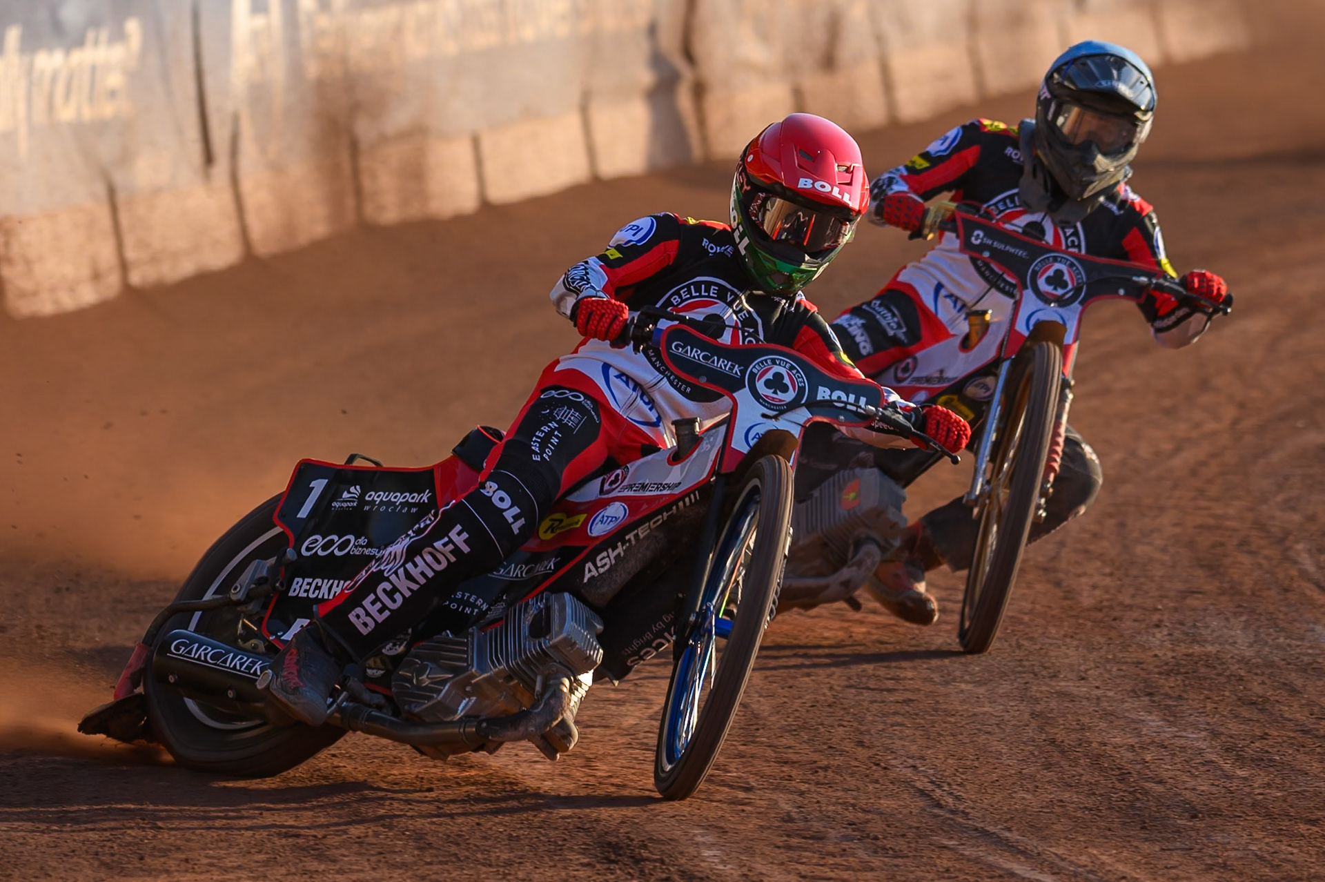 Brady Kurtz of Belle Vue Aces in Red leading Norick Blodorn of Belle Vue Aces in Blue during the Rowe Motor Oil Premiership match between Belle Vue Aces and Northampton Foxes at the National Speedway Stadium, Manchester on Monday 13th July 2026. (Photo: Ian Charles | MI News)