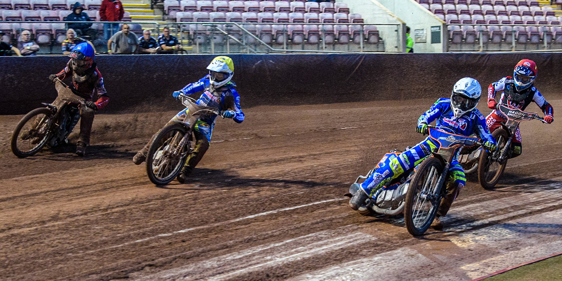 Oxford Chargers' Luke Killeen  in White rides inside Oxford Chargers' Jody Scott  in Yellow Belle Vue Colts' Freddy Hodder  in Blue and Belle Vue Colts' Sam Hagon  in Red during the WSRA National Development League match between Belle Vue Colts and Oxford Chargers at the National Speedway Stadium, Manchester on Friday 2nd August 2024. (Photo: Ian Charles | MI News)