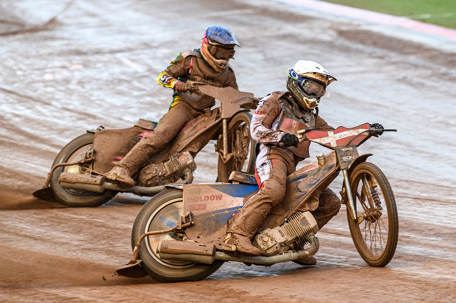 Bastian Pedersen of Denmark in White leading James Pearson of Australia in Blue during the Monster Energy FIM Speedway of Nations 2 (Under 21) Final at the National Speedway Stadium, Manchester on Friday 12th July 2024. (Photo: Ian Charles | MI News)