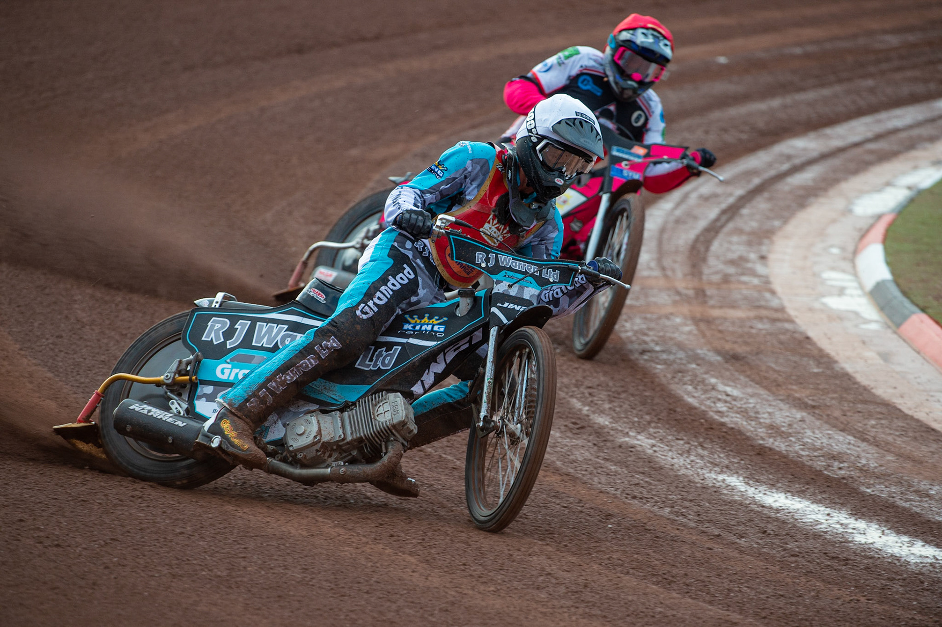MANCHESTER, UK. JULY 2ND  Josh Warren  (White) leads Sam Woolley  (Red)during the National Development League match between Belle Vue Colts and Kent Royals at the National Speedway Stadium, Manchester on Friday 2nd July 2021. (Credit: Ian Charles | MI News)