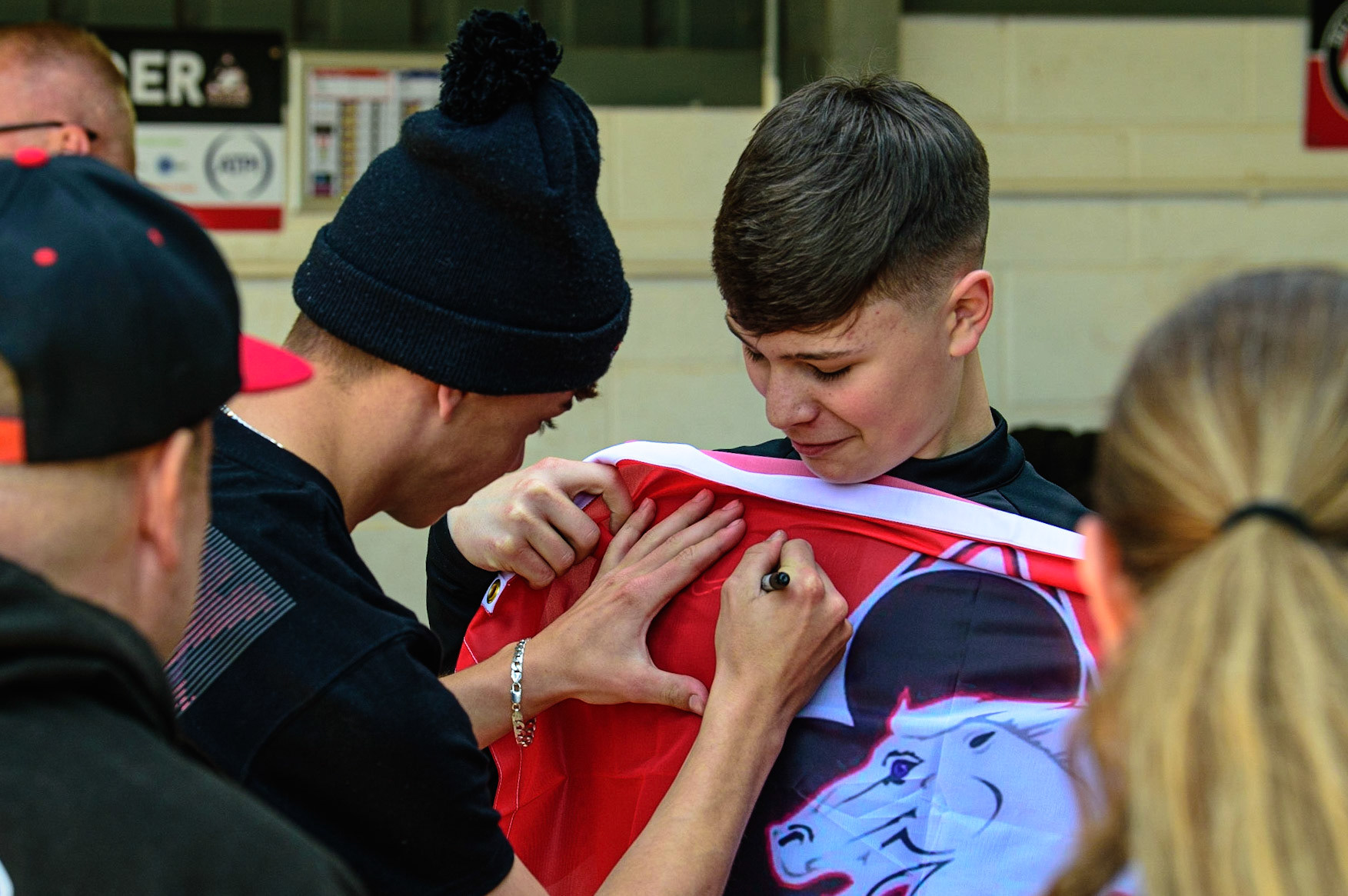 MANCHESTER, UK.  JUN 3RD  Freddy Hodder (left) signs a fans flag held by team mate Sam McGurk  during the National Development League match between Belle Vue Colts and Oxford Chargers at the National Speedway Stadium, Manchester on Friday 3rd June 2022. (Credit: Ian Charles | MI News)