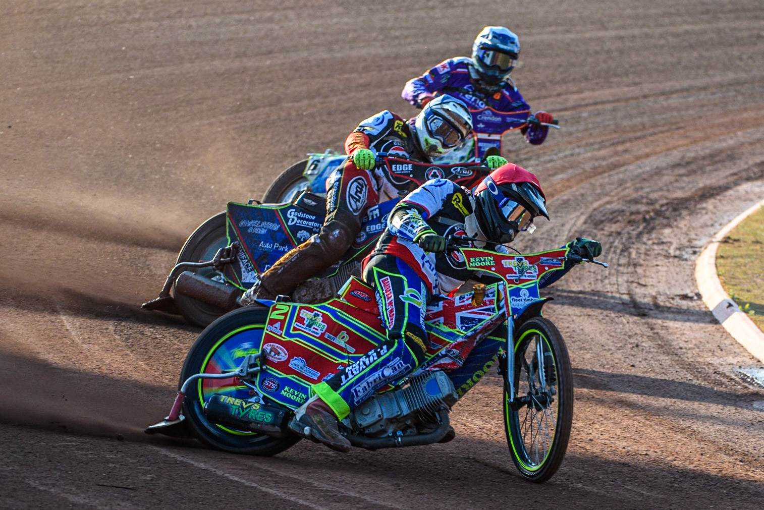 Simon Lambert (Red) leads Jake Mulford (Blue) and Hans Andersen (White) during the Sports Insure Premiership match between Belle Vue Aces and Peterborough at the National Speedway Stadium, Manchester on Monday 19th June 2023. (Photo: Ian Charles | MI News)