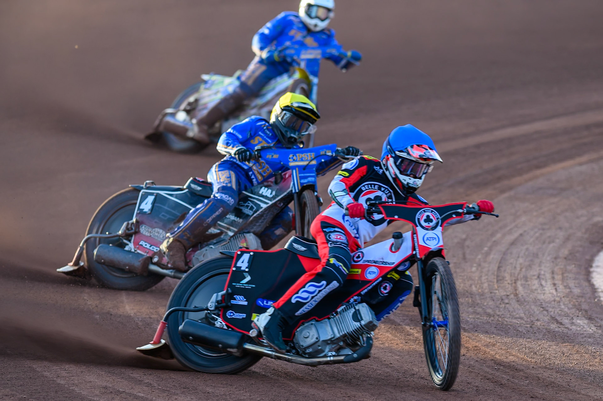 Zach Cook of Belle Vue Aces in Blue leading  Ben Cook of Kings Lynn Stars in Yellow with Chris Harris of Kings Lynn Stars in White  behind during the Rowe Motor Oil Premiership match between Belle Vue Aces and King's Lynn Stars at the National Speedway Stadium, Manchester on Monday 10th August 2026. (Photo: Ian Charles | MI News)