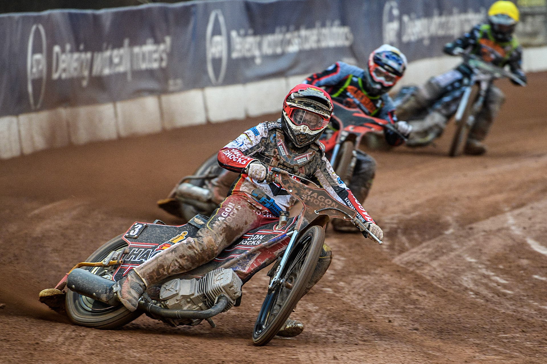 Sam Hagon (Red) leads Alfie Bowtell (White) and Josh Warren (Yellow) during the National Development League match between Belle Vue Colts and Mildenhall Fens Tigers at the National Speedway Stadium, Manchester on Friday 26th May 2023. (Photo: Ian Charles | MI News)