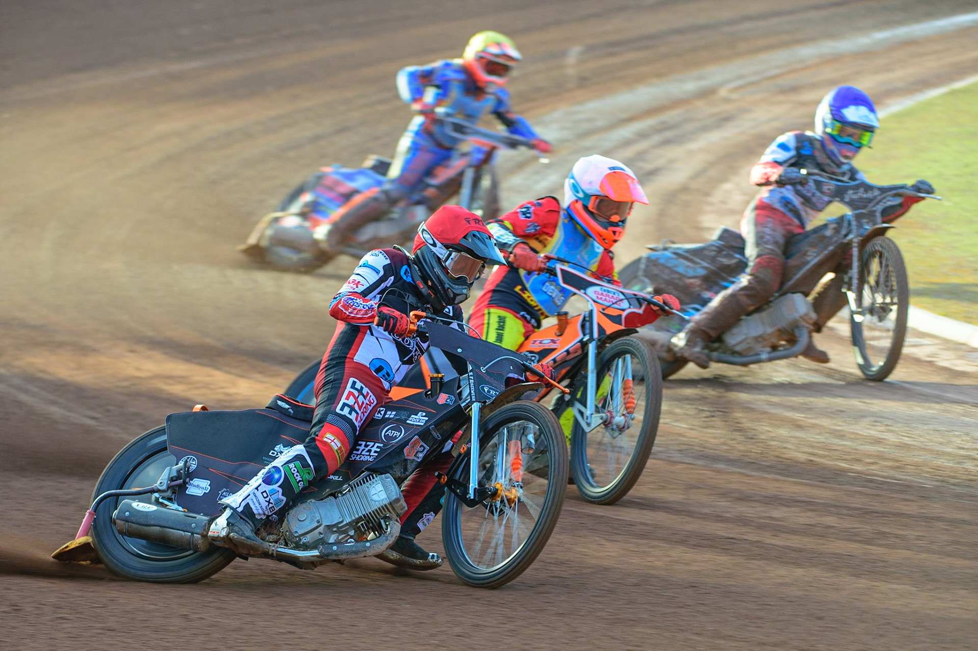 MANCHESTER, UK. MAY 27TH Jack Smith  (Red) outside Connor Coles (White) and Freddy Hodder  (Blue) with Lewis Millar (Yellow) behind during the National Development League match between Belle Vue Colts and Armadale Devils at the National Speedway Stadium, Manchester on Friday 27th May 2022. (Credit: Ian Charles | MI News)