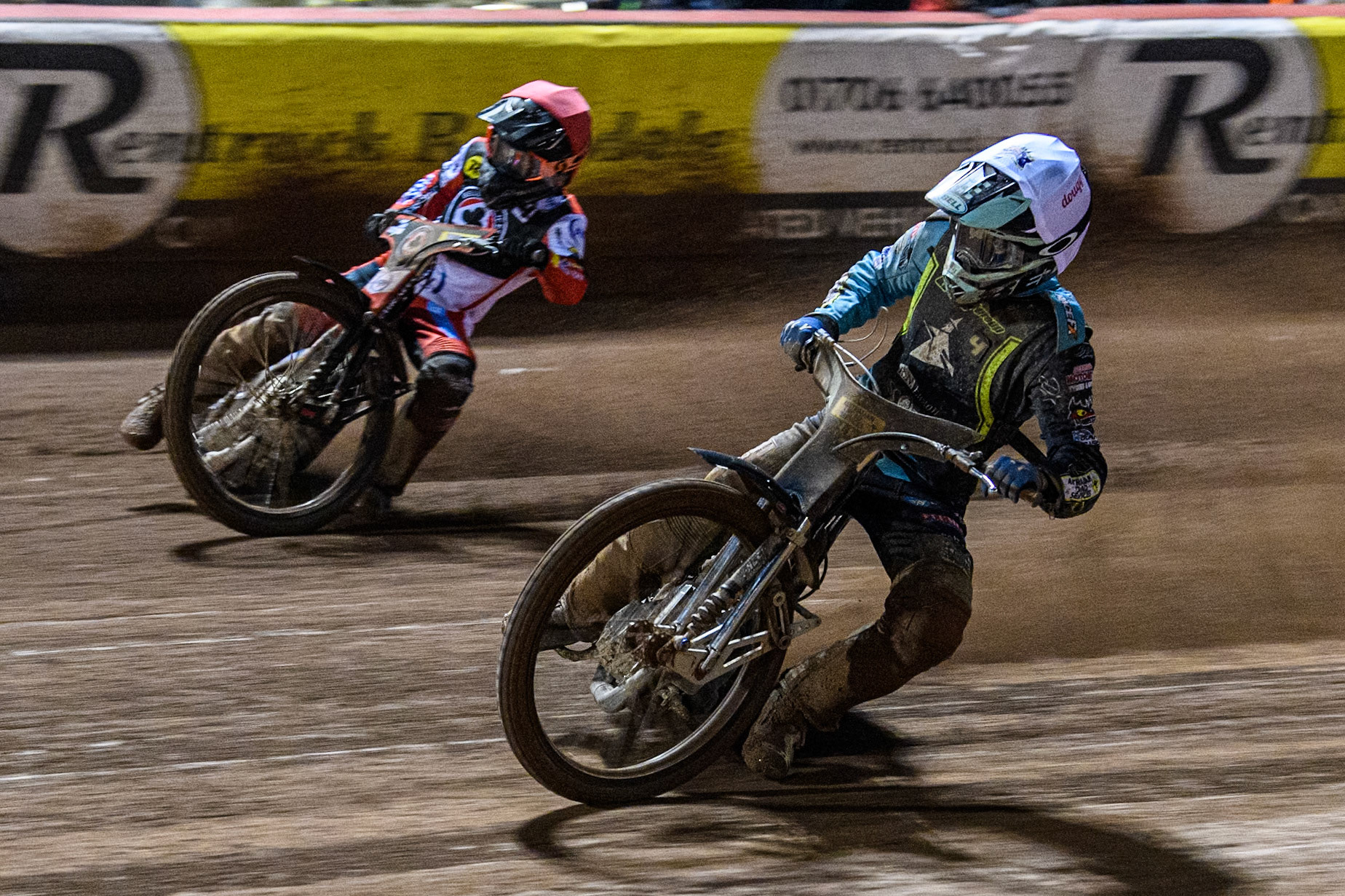Ipswich Witches' Guest Ryan Douglas in White rides inside Belle Vue Aces' Ben Cook in Red during the Rowe Motor Oil Premiership match between Belle Vue Aces and Ipswich Witches at the National Speedway Stadium, Manchester on Monday 22nd April 2024. (Photo: Ian Charles | MI News)