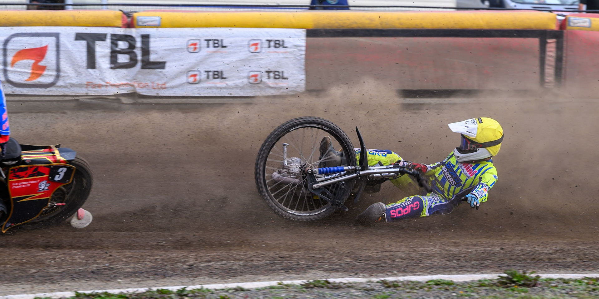 Harry Fletcher of Oxford Chargers in Yellow  falls behind Luke Harris of Buxton Bulls in Red  and Arran Butcher of Buxton Bulls in Blue  during the WSRA National Development League match between Buxton Bulls and Oxford Chargers at Hi-Edge Speedway, Buxton on Sunday 2nd August 2026. (Photo: Ian Charles | MI News)