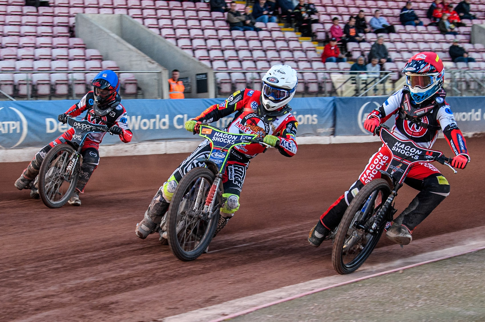 Belle Vue Colts' Sam Hagon in Red rides inside Middlesbrough Tigers' Jake Mulford in White and Belle Vue Colts' Freddy Hodder in Blue during the WSRA National Development League match between Belle Vue Colts and Middlesbrough Tigers at the National Speedway Stadium, Manchester on Monday 17th June 2024. (Photo: Ian Charles | MI News)