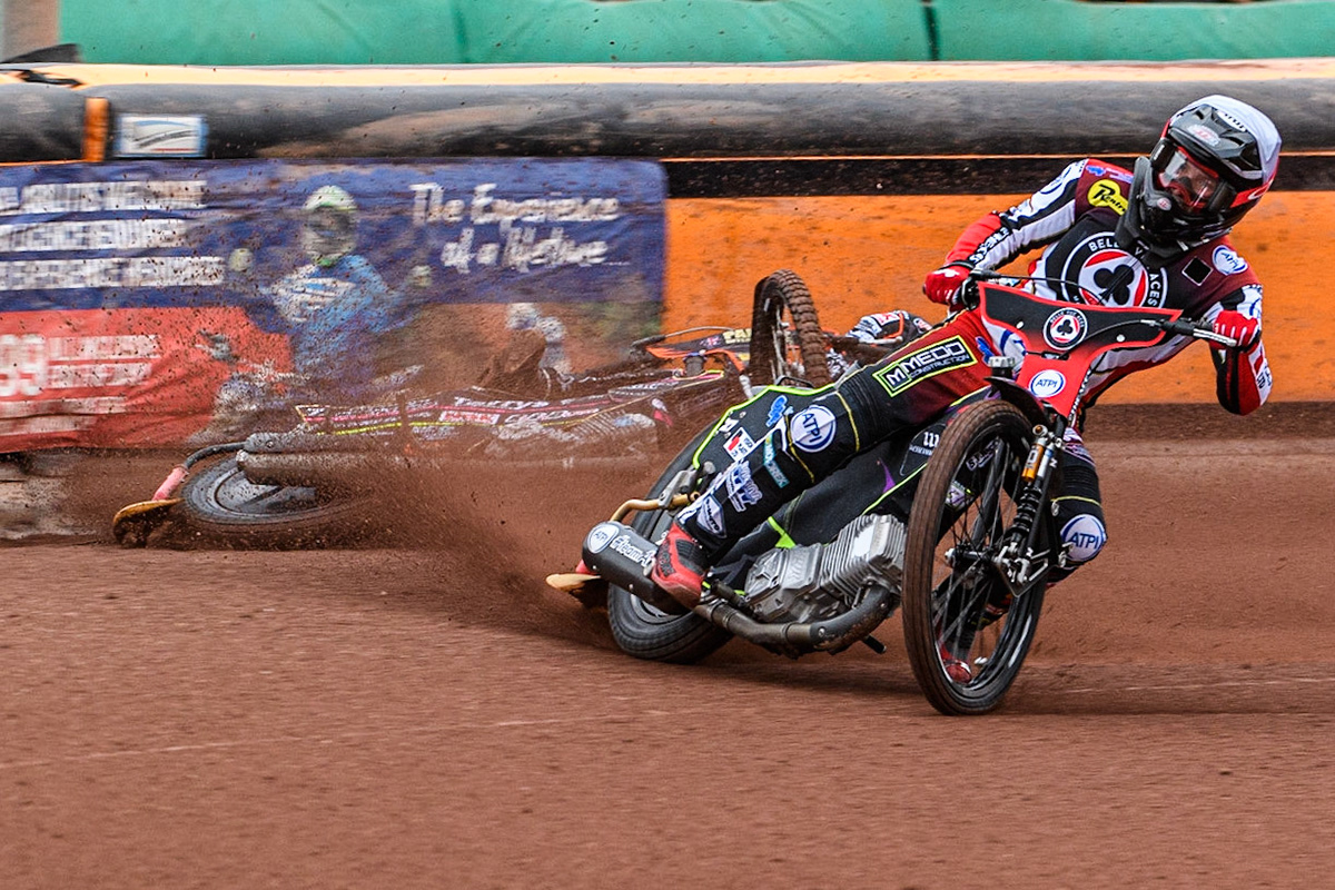 Tom Brennan (White) inside Leon Flint (Blue) as he falls in the first bend during the Sports Insure Premiership match between Wolverhampton Wolves and Belle Vue Aces at Monmore Green Stadium, Wolverhampton on Monday 10th July 2023. (Photo: Ian Charles | MI News)