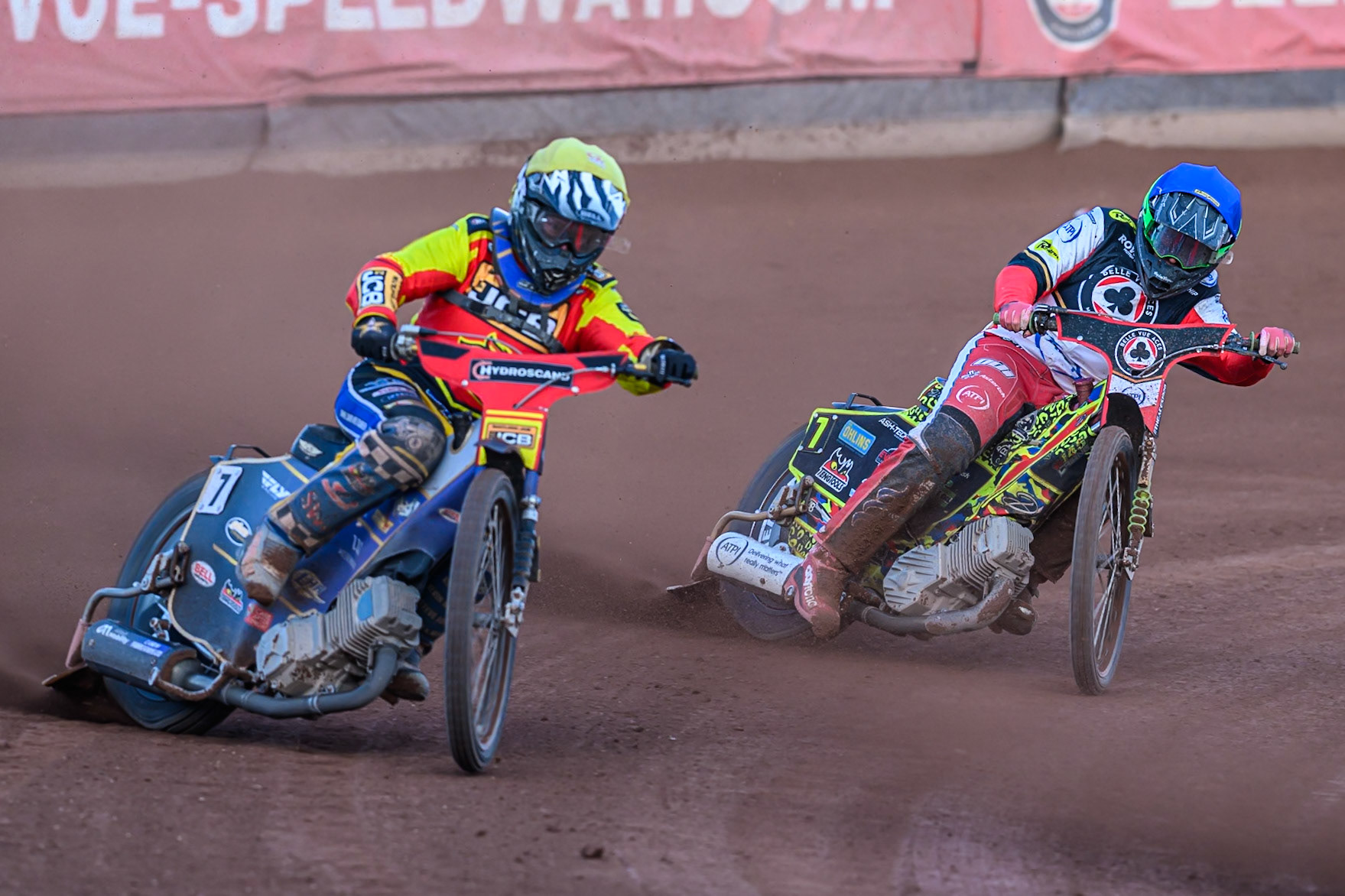 Leicester Lions' Joe Thompson  in Yellow leading Belle Vue Aces' Will Cairns in Blue during the Rowe Motor Oil Premiership match between Belle Vue Aces and Leicester Lions at the National Speedway Stadium, Manchester on Monday 14th July 2025. (Photo: Ian Charles | MI News)