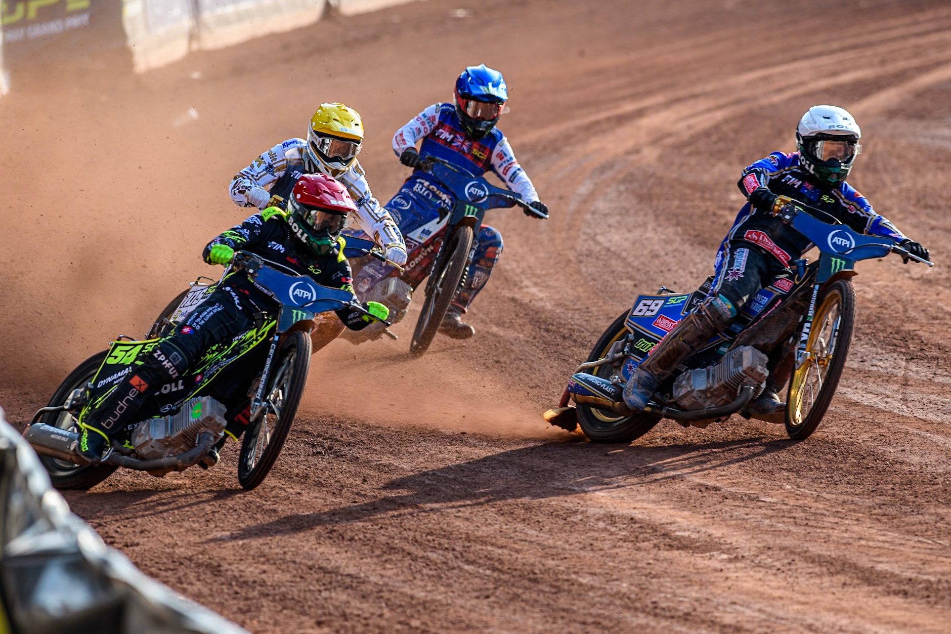 Jason Doyle (69) of Australia in White rides inside Martin Vaculik (54) of Slovakia in Red with Anders Thomsen (105) of Denmark in Yellow and Dan Bewley (99) of Great Britain in Blue behind during the ATPI FIM Speedway Grand Prix Round 5 at the National Speedway Stadium, Manchester, on Saturday 14th June 2025. (Photo: Ian Charles | MI News)