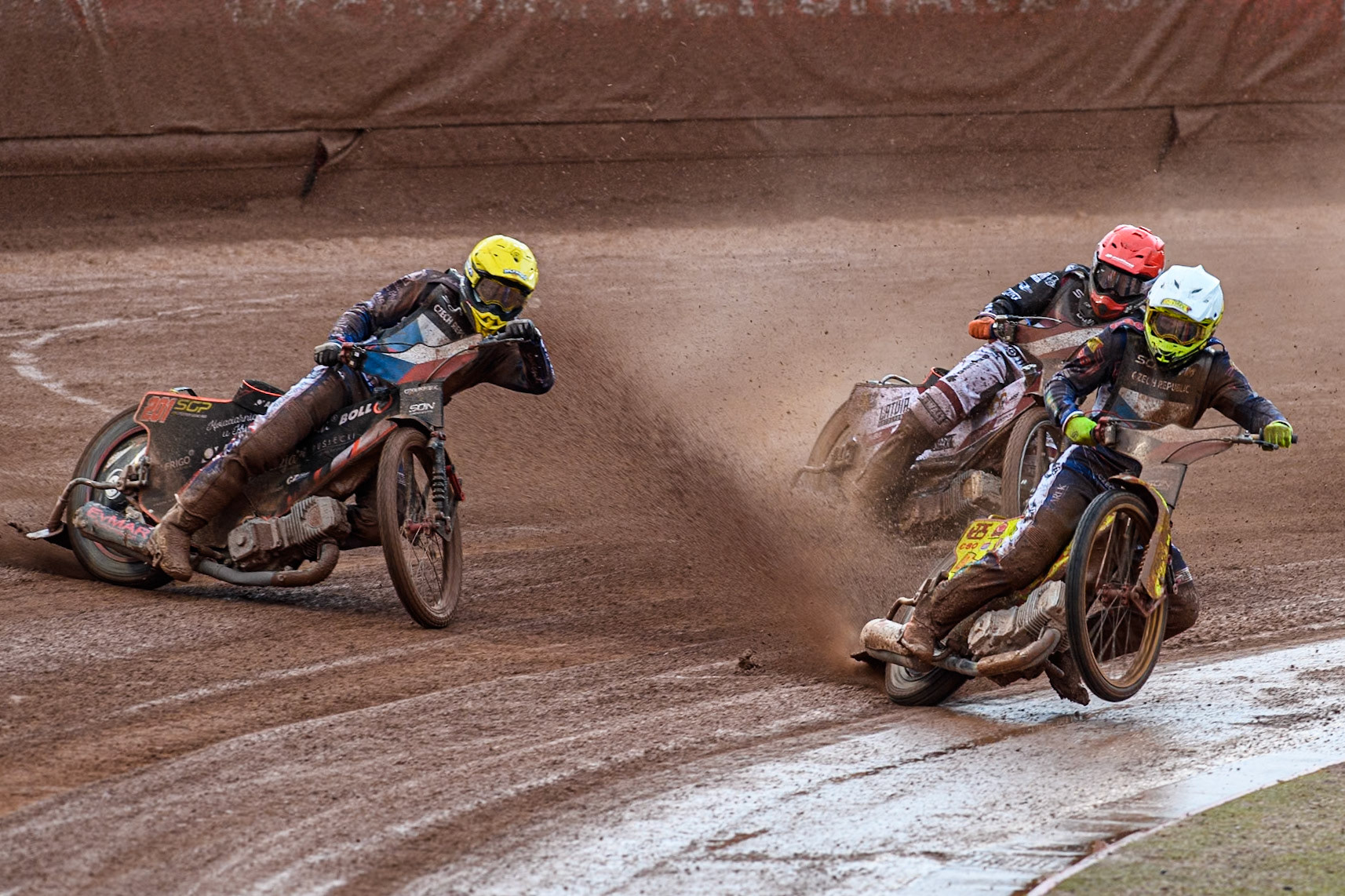 Vaclav Milik of The Czech Republic in White picks up some drive as he rides inside Jan Kvech of The Czech Republic in Yellow with Andzejs Lebedevs of Latvia behind during the Monster Energy FIM Speedway of Nation Semi Final 2 at the National Speedway Stadium, Manchester on Wednesday 10th July 2024. (Photo: Ian Charles | MI News)