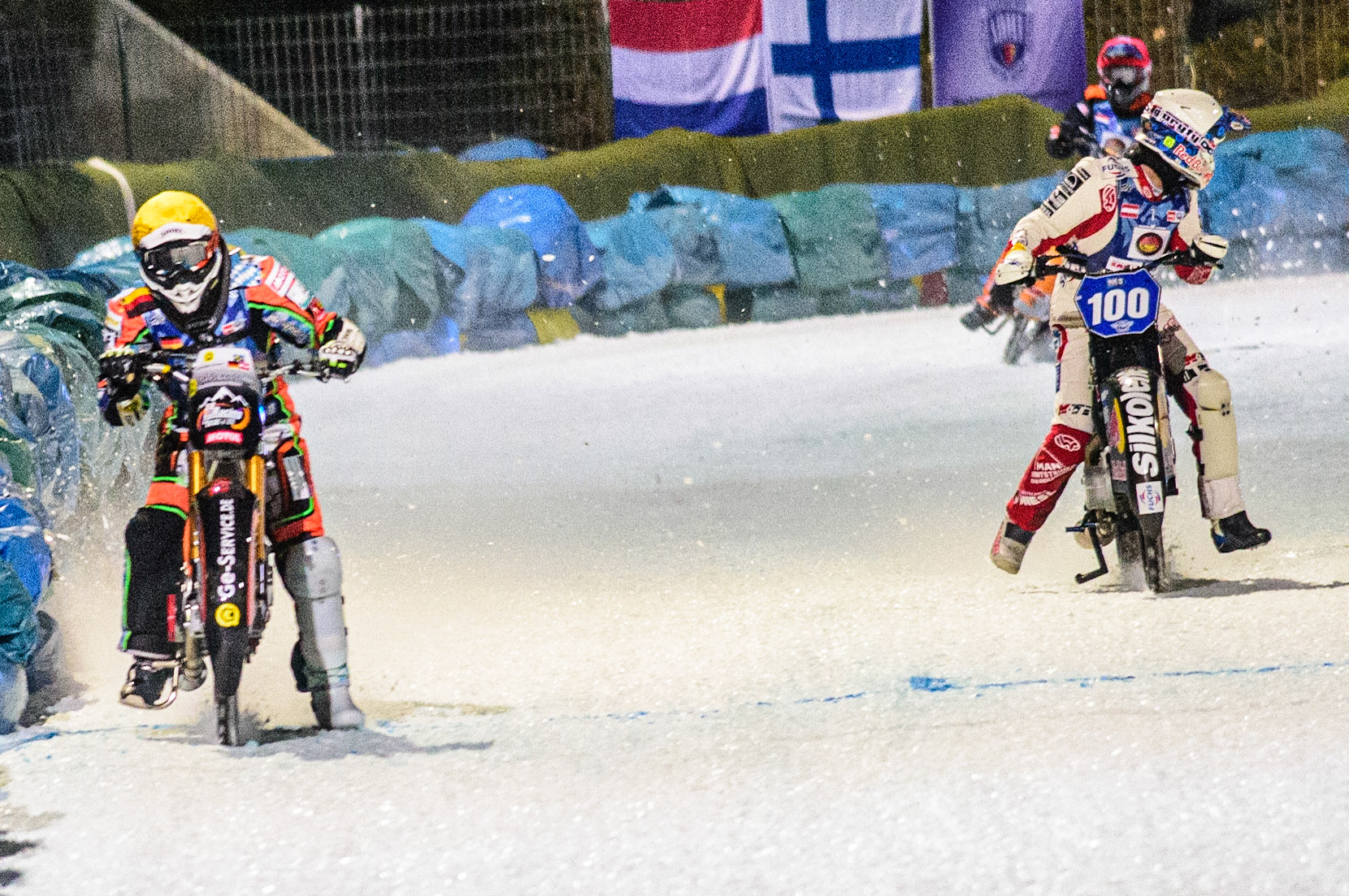 Markus Jell (Yellow) leads Franz Zorn (White) who looks behind as another rider has fallen during the German Individual Ice Speedway Championship at Horst-Dohm-Eisstadion, Berlin on Friday 3rd March 2023. (Photo: Ian Charles | MI News)
