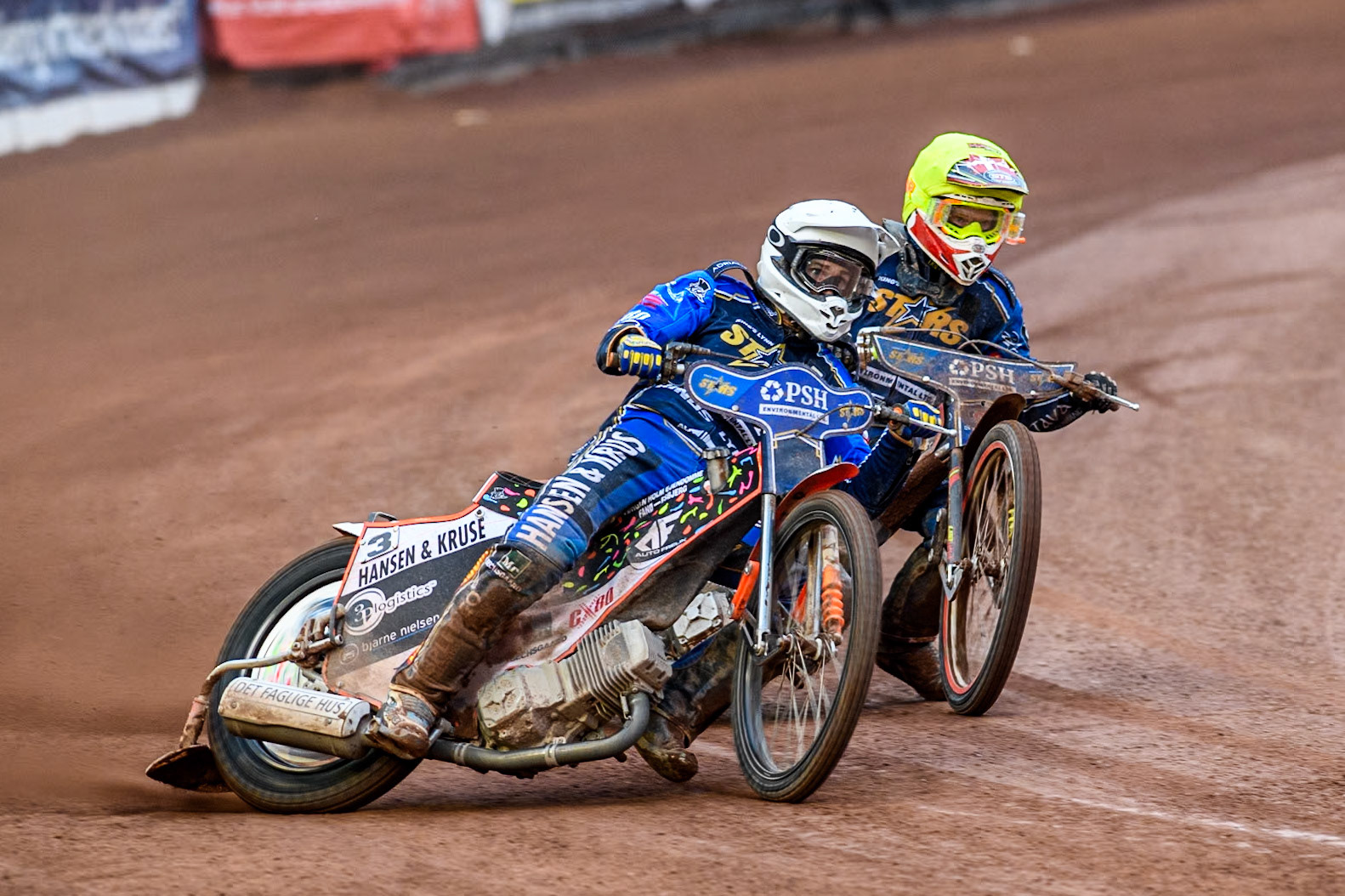 King Lynn Stars' Niels-Kristian Iversen in White leading team mate King Lynn Stars' Michael Palm Toft in Yellow during the Rowe Motor Oil Premiership match between Belle Vue Aces and King's Lynn Stars at the National Speedway Stadium, Manchester on Monday 20th May 2024. (Photo: Ian Charles | MI News)