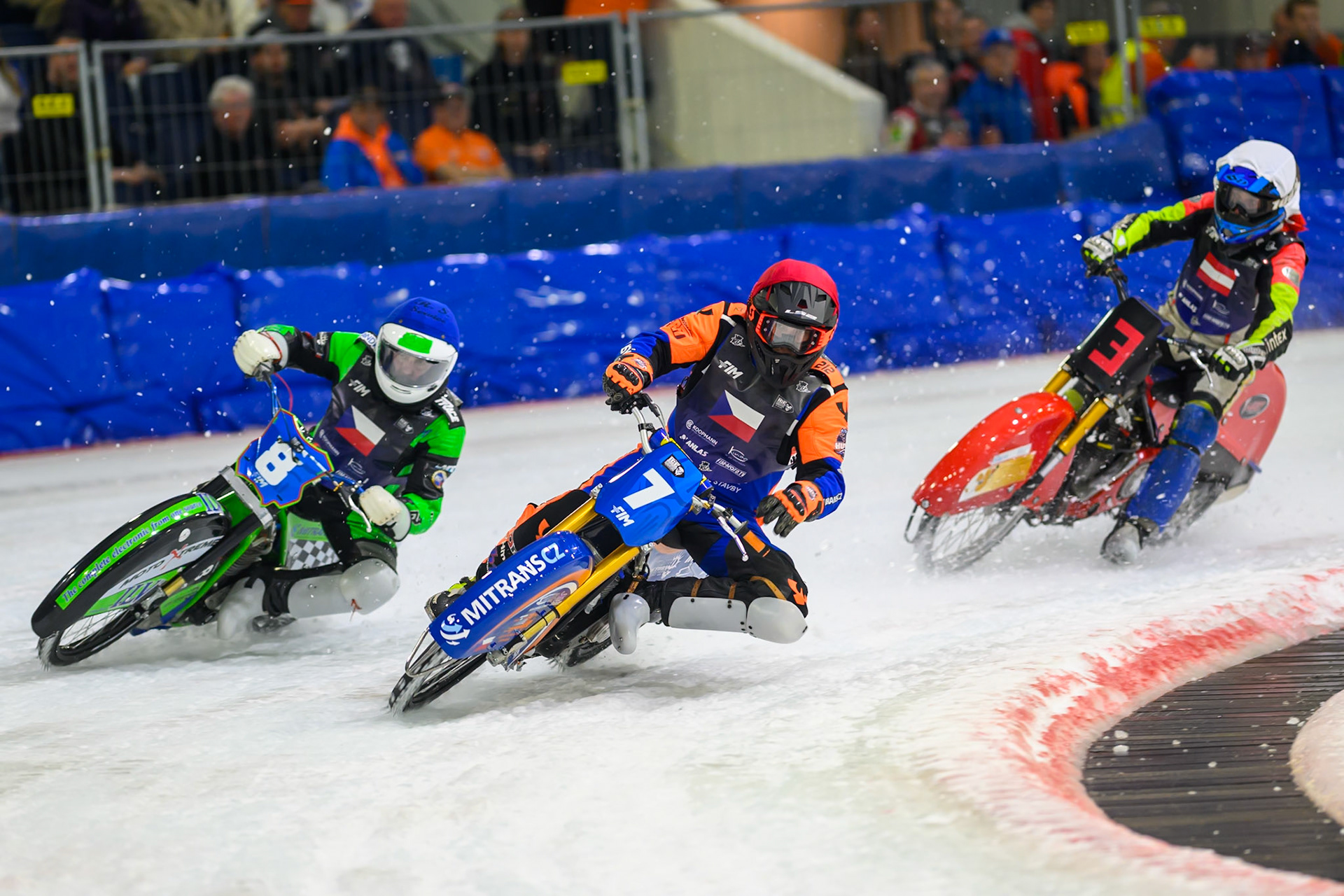 Lukáš Hutla (7) of Czechia in Red leading Andrej Diviš (8) of Czechia  in Blue and Harald Simon (3) of Austria   in White in the re-run of heat 8 during the FIM Ice Speedway Of Nations at Ice Rink Thialf, Heerenveen on Sunday 12th April 2026. (Photo: Ian Charles | MI News)