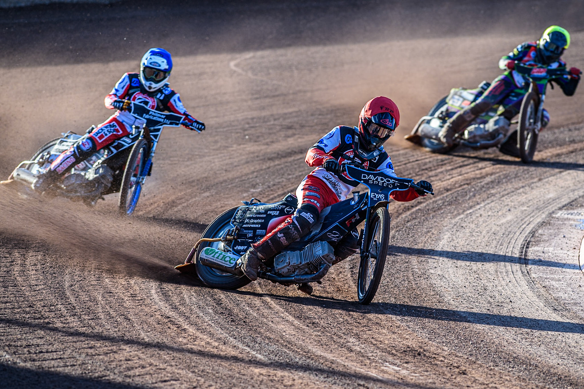 Belle Vue Colts' Freddy Hodder in Red leading Belle Vue Colts' Jack Shimelt in Blue and Middlesbrough Tigers' Kai Ward in Yellow during the WSRA National Development League match between Belle Vue Colts and Middlesbrough Tigers at the National Speedway Stadium, Manchester on Monday 17th June 2024. (Photo: Ian Charles | MI News)