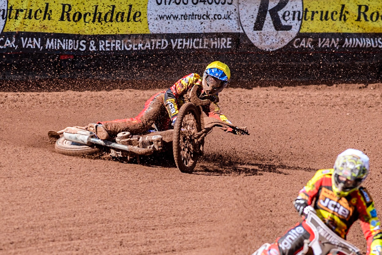 Leicester Lion Cubs' Sonny Springer  (Yellow) falls behind team mate Leicester Lion Cubs' Luke Crang (White) during the WSRA  National Development League match between Belle Vue Colts and Leicester Lion Cubs at the National Speedway Stadium, Manchester on Friday 29th March 2024. (Photo: Ian Charles | MI News)